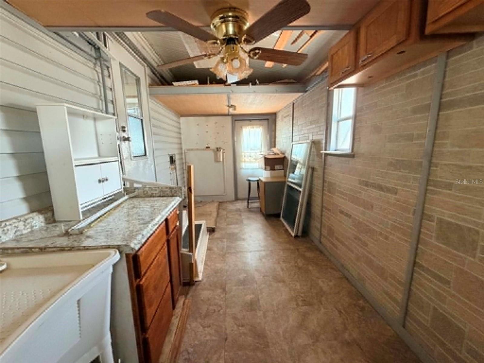 Utility room off of primary bedroom and side of house - 50989 HIGHWAY 27 #87, DAVENPORT