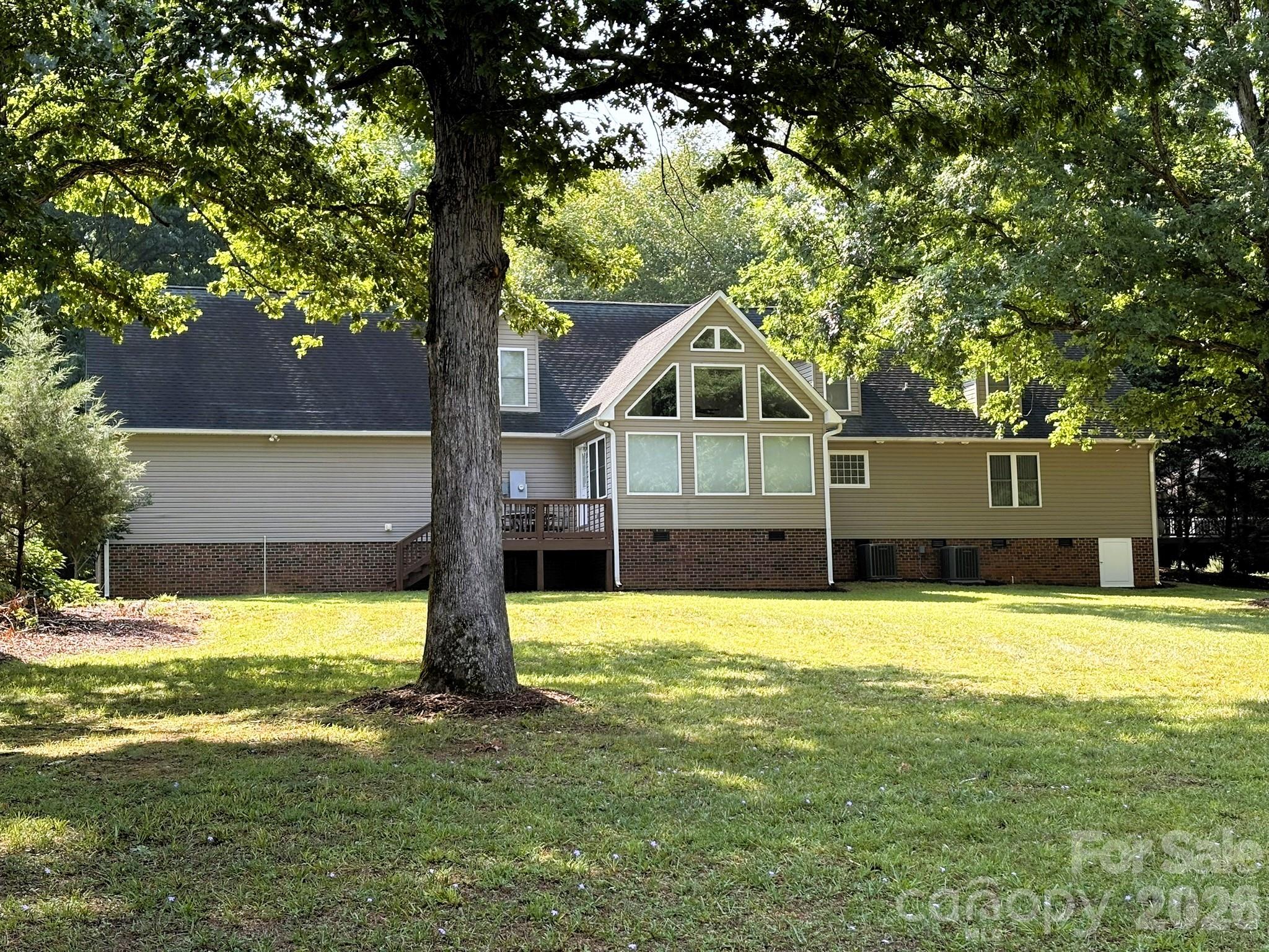 Back of the home, facing Lake Tillery - 130 Canoe Court, Mount Gilead