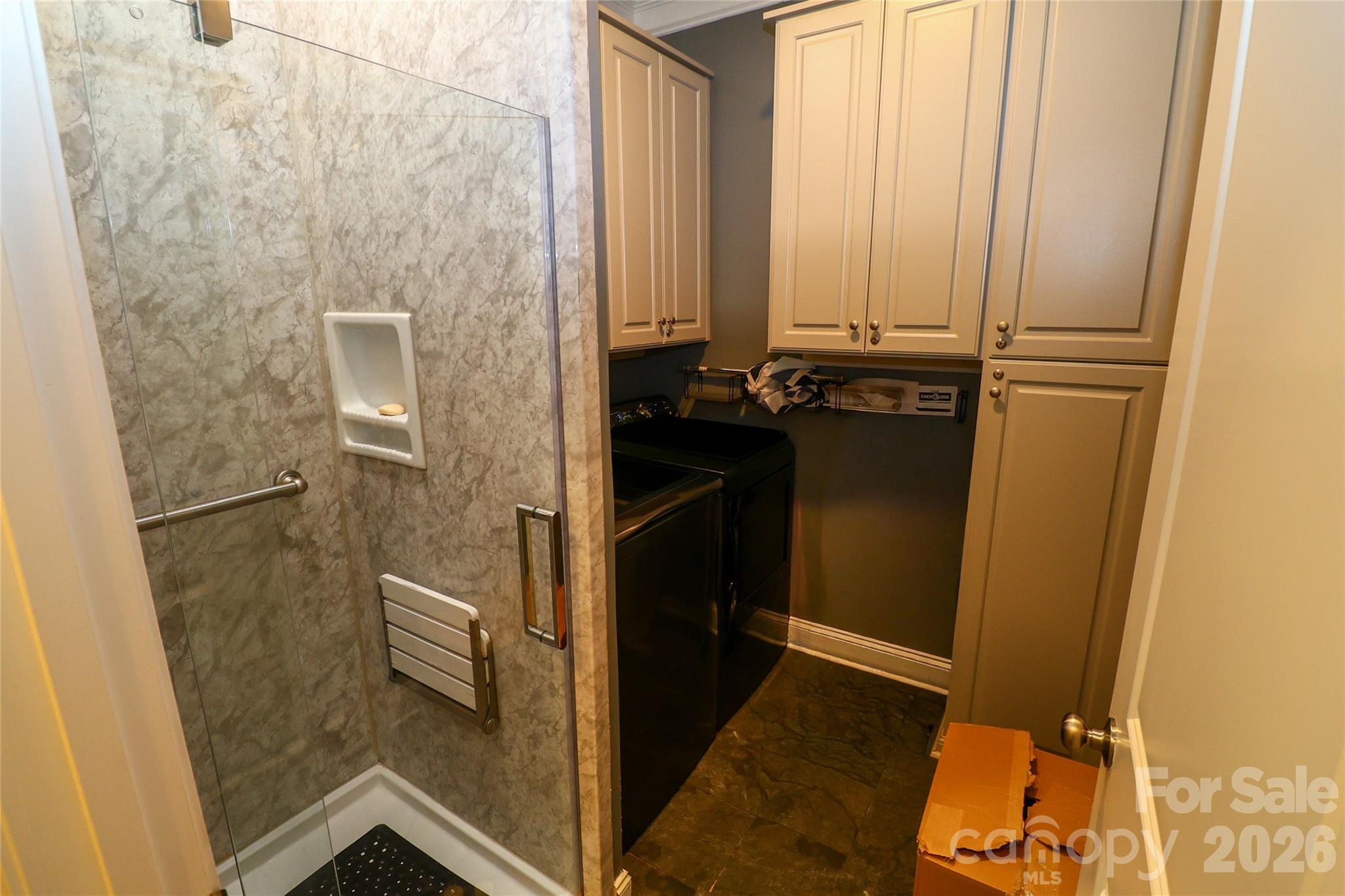 Laundry room with additional shower. - 109 E Americana Drive, Mooresville