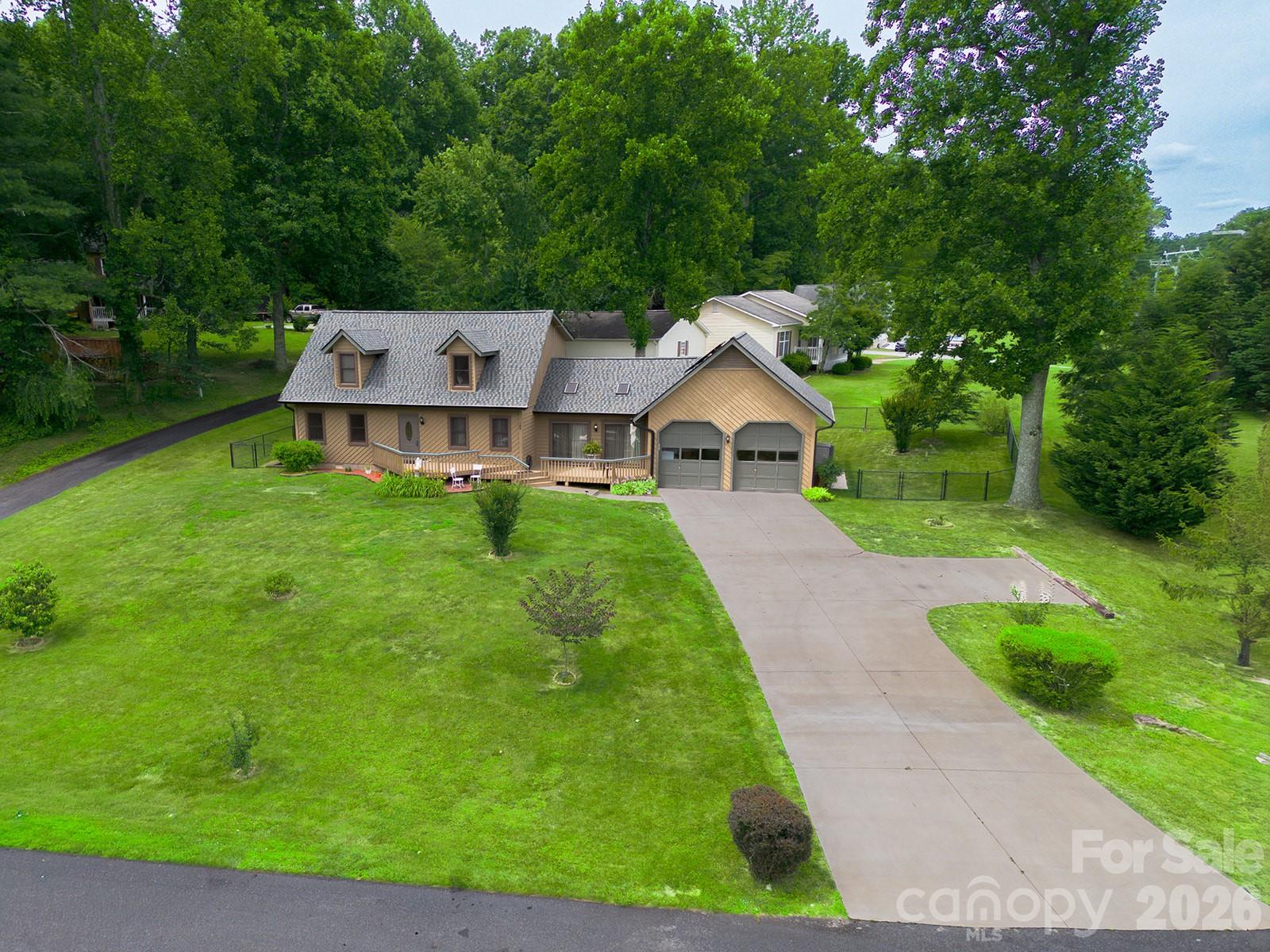 Oversized garage and additional parking pad in driveway - 100 Forest Park Drive, Hendersonville