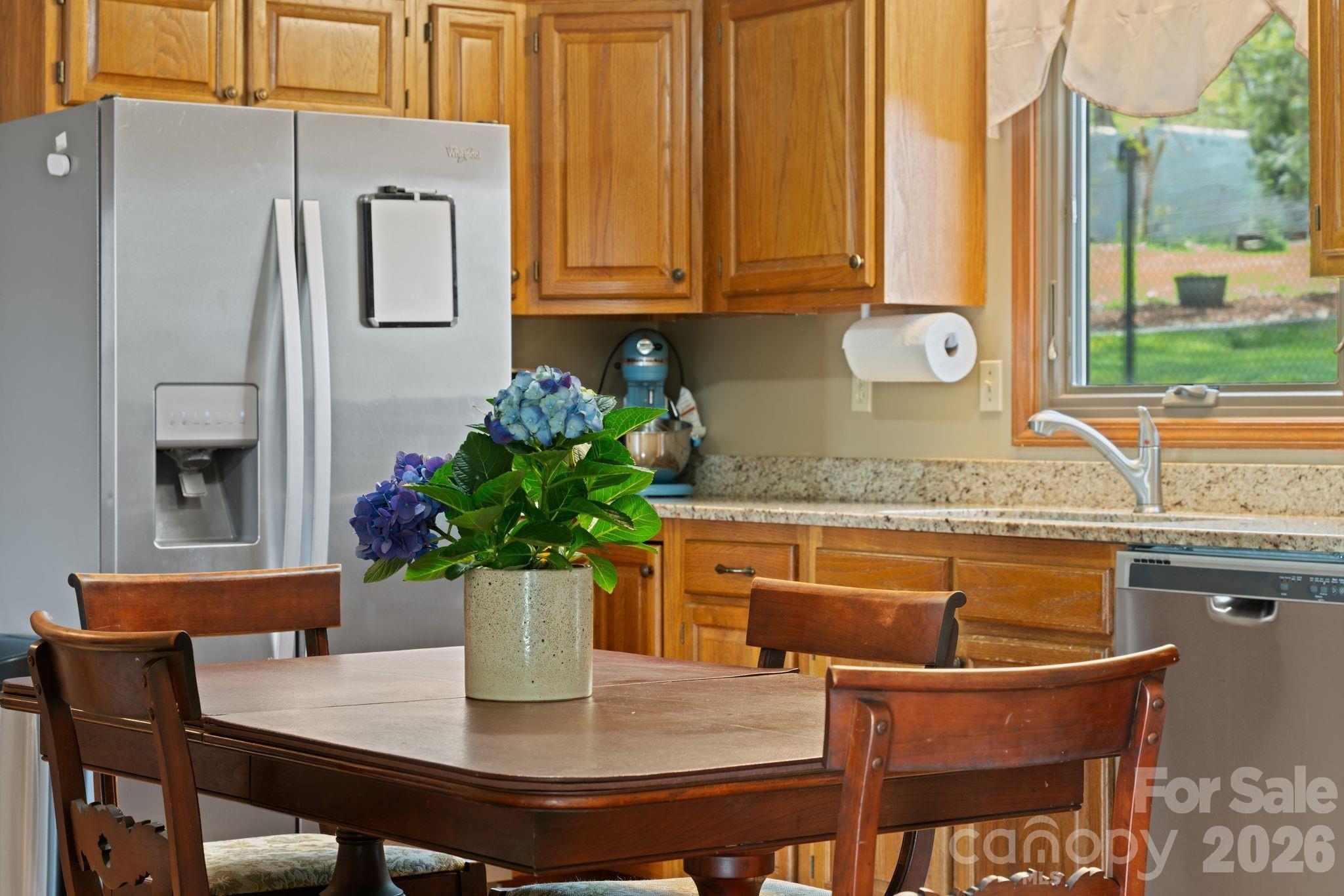 Room for a generously sized table in the eat-in kitchen - 100 Forest Park Drive, Hendersonville