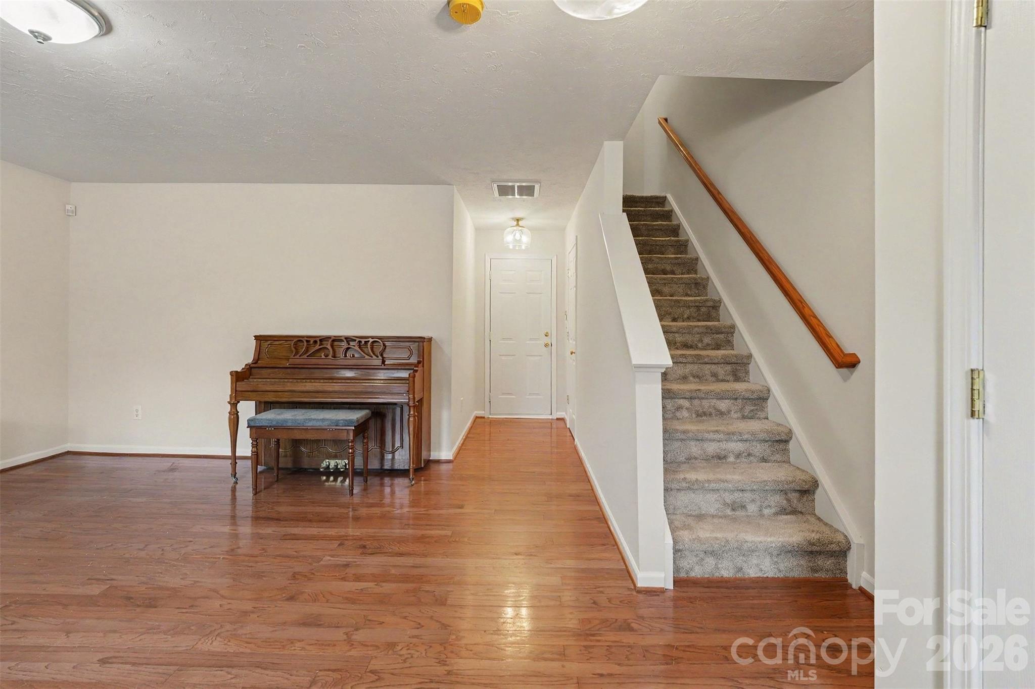 1st floor entry in formal living or great flex space - 9866 Treeside Lane, Matthews