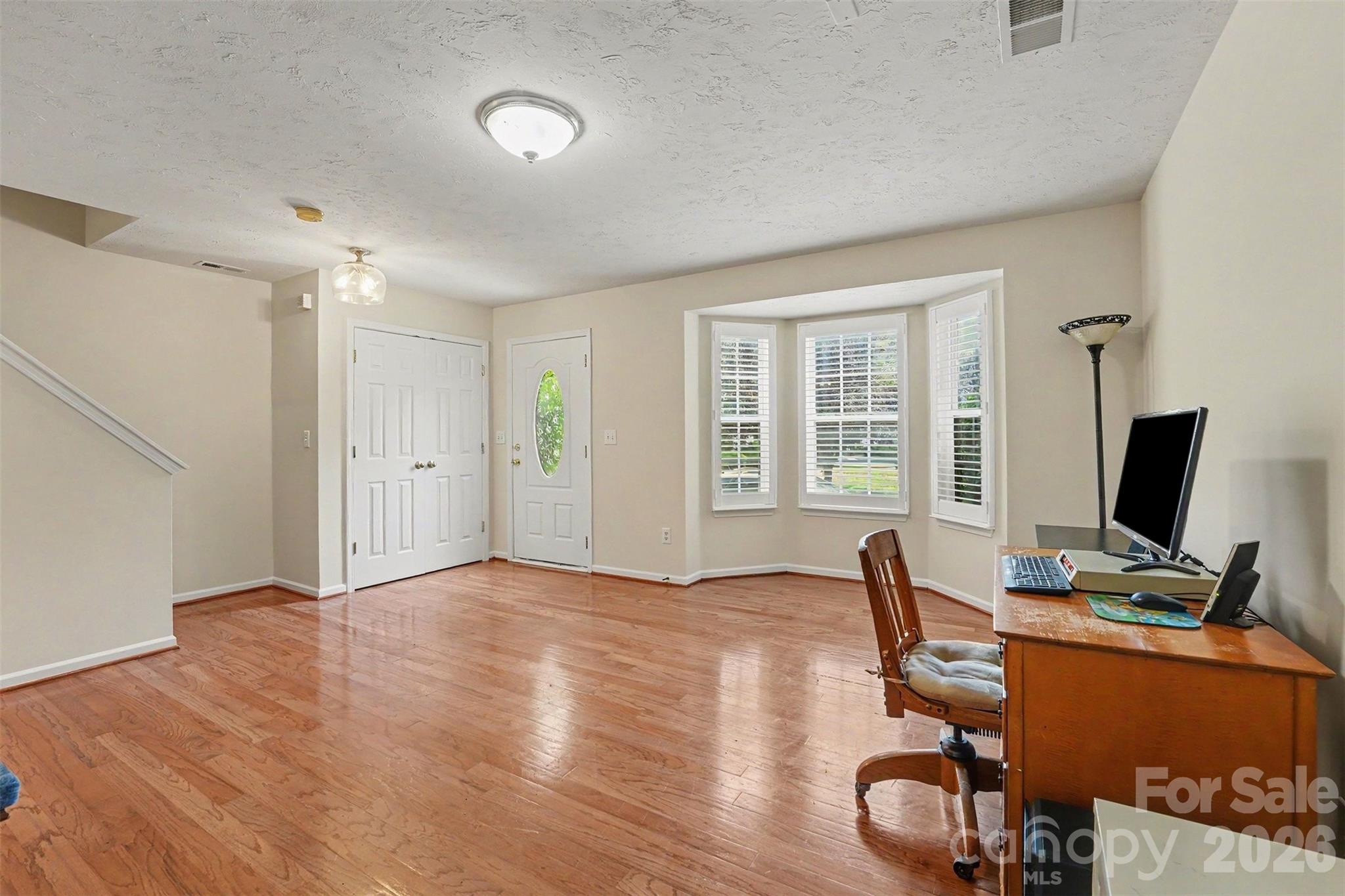 1st floor front door featuring formal living room or flex space - 9866 Treeside Lane, Matthews
