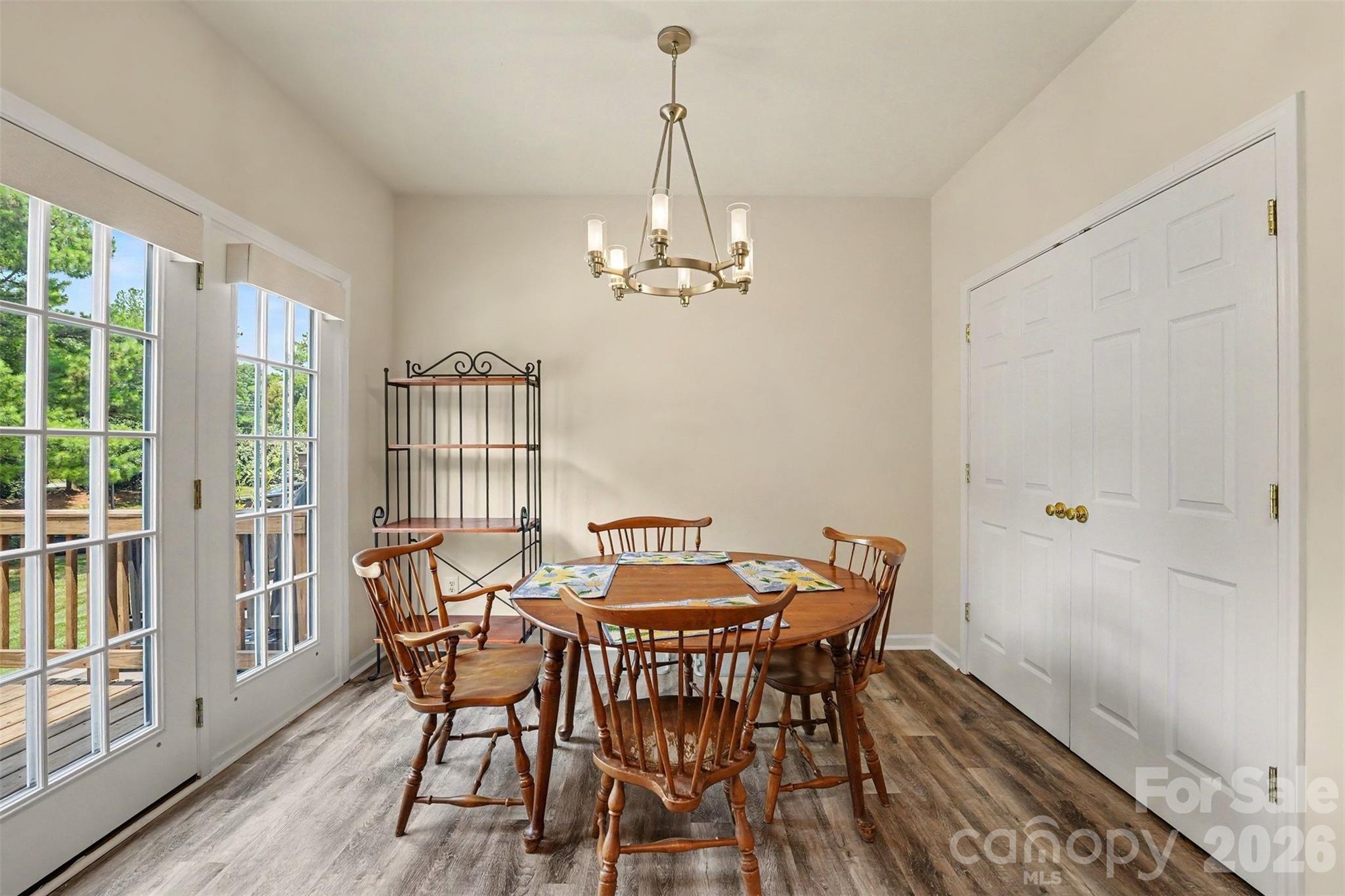 2nd floor dining area with entry door out to the deck - 9866 Treeside Lane, Matthews