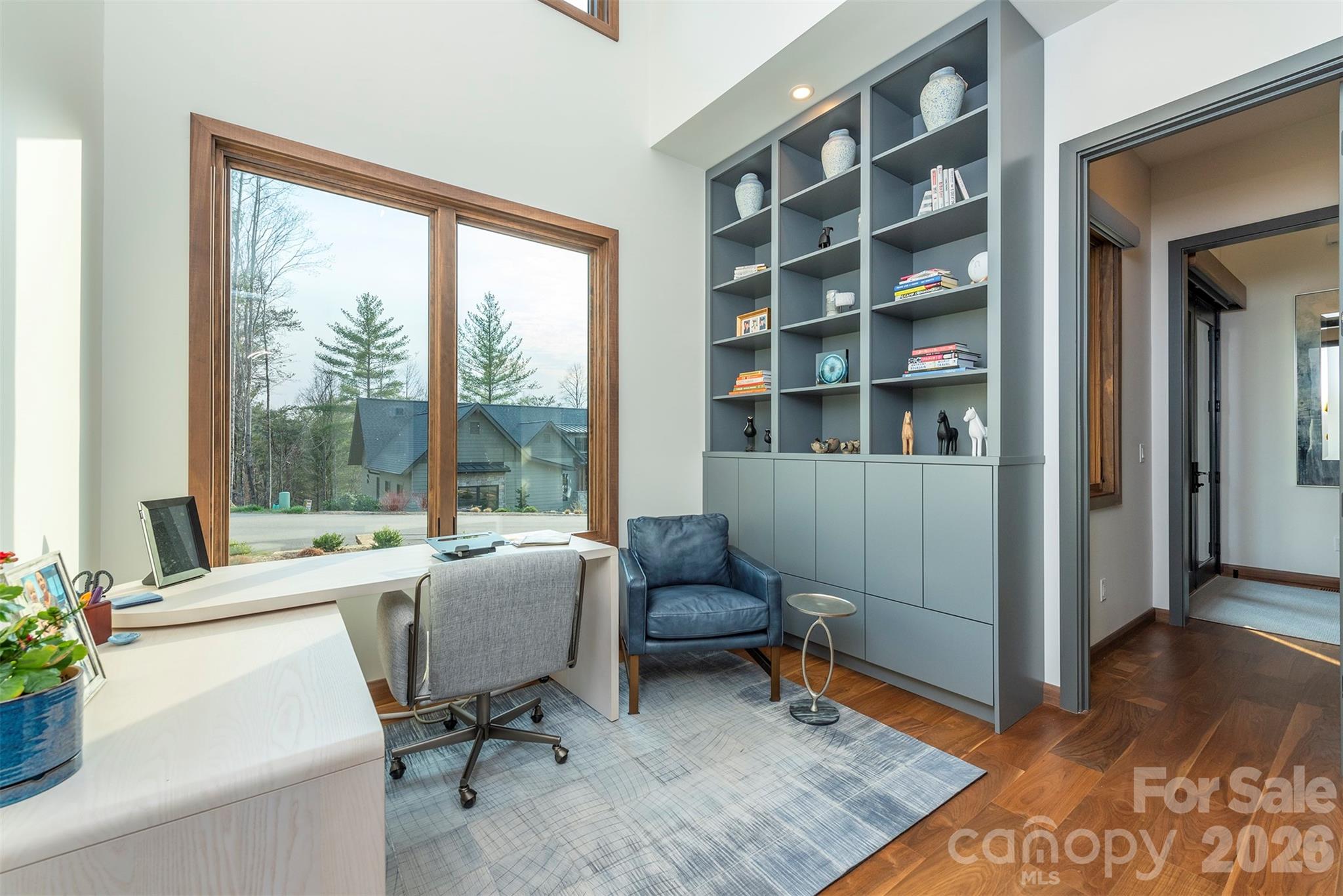 4th bedroom or Den/Office complete with built ins and automatic blinds have been added - 158 Riverbend Forest Drive, Asheville