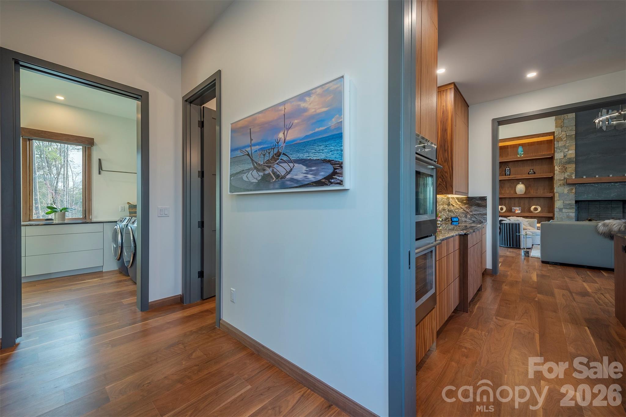 Pantry room off kitchen leading to a full laundry room - 158 Riverbend Forest Drive, Asheville