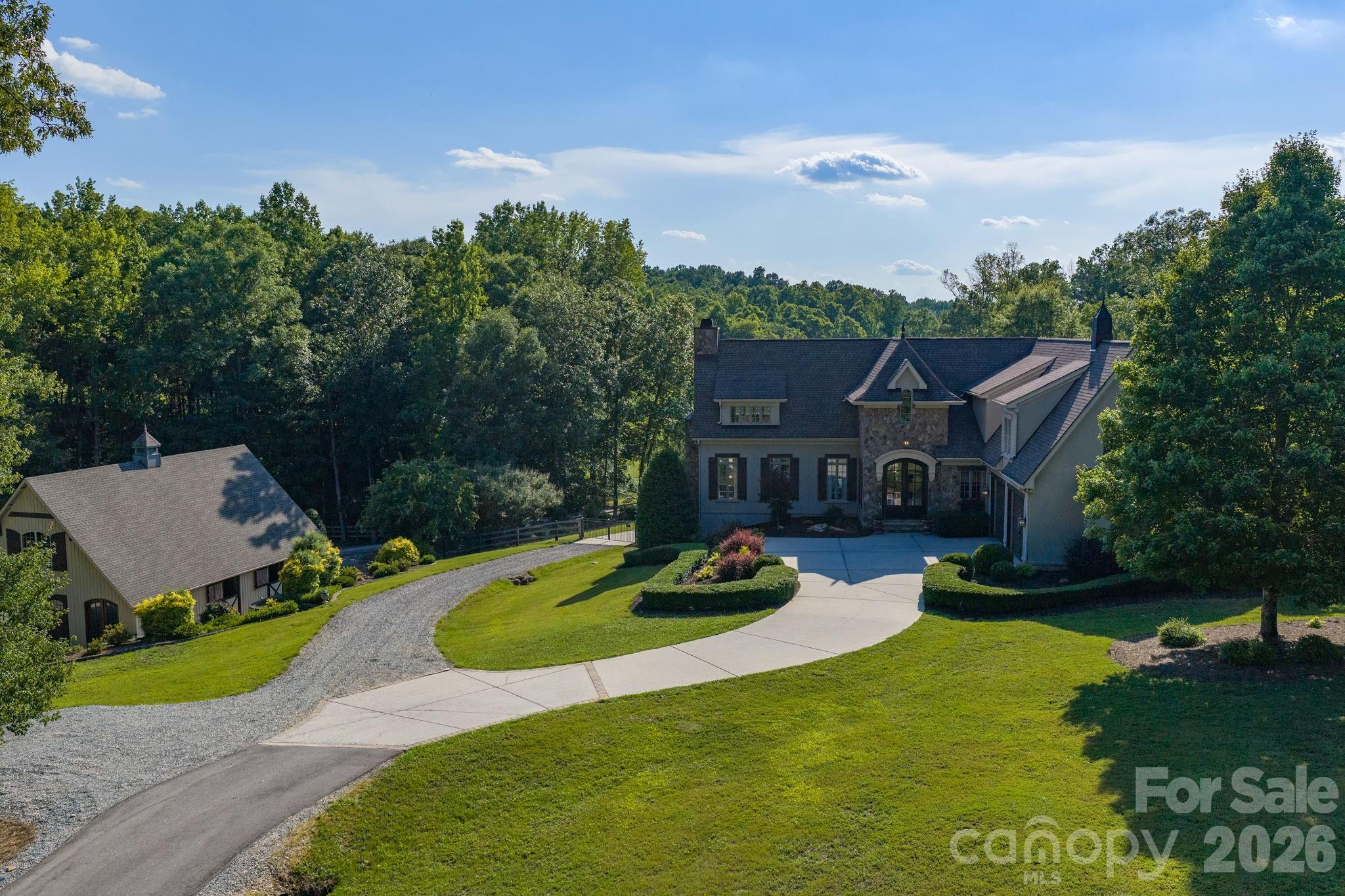 Situated on a gated 11.6 private acres - 8528 Waxhaw Creek Road, Waxhaw