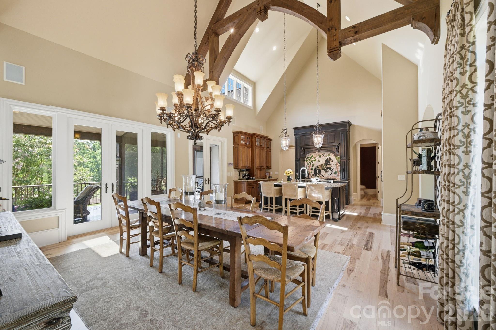 French doors and windows overlooking deck and screened in porch - 8528 Waxhaw Creek Road, Waxhaw