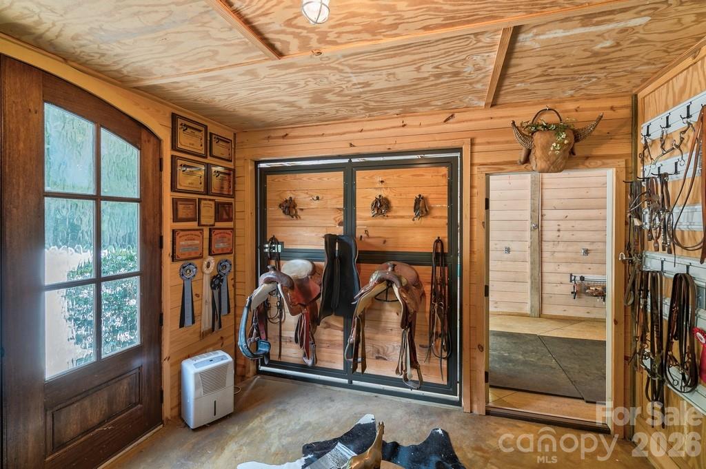 Tack room with tongue & grove walls, glass and mahogany french doors - 8528 Waxhaw Creek Road, Waxhaw