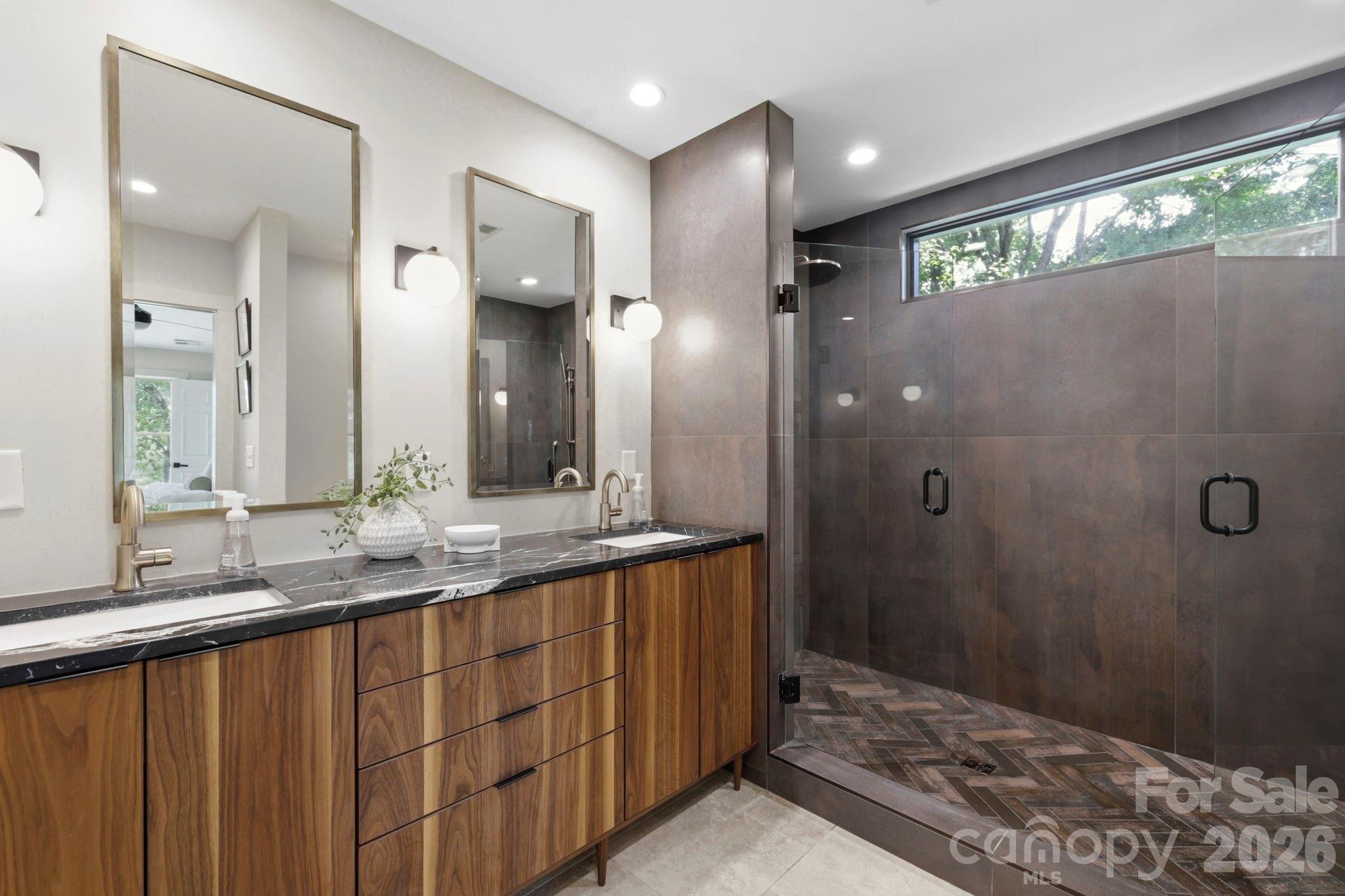Redesigned primary bath with dual vanities and Toto toilet - 114 Cane Creek Ranch Drive, Fletcher
