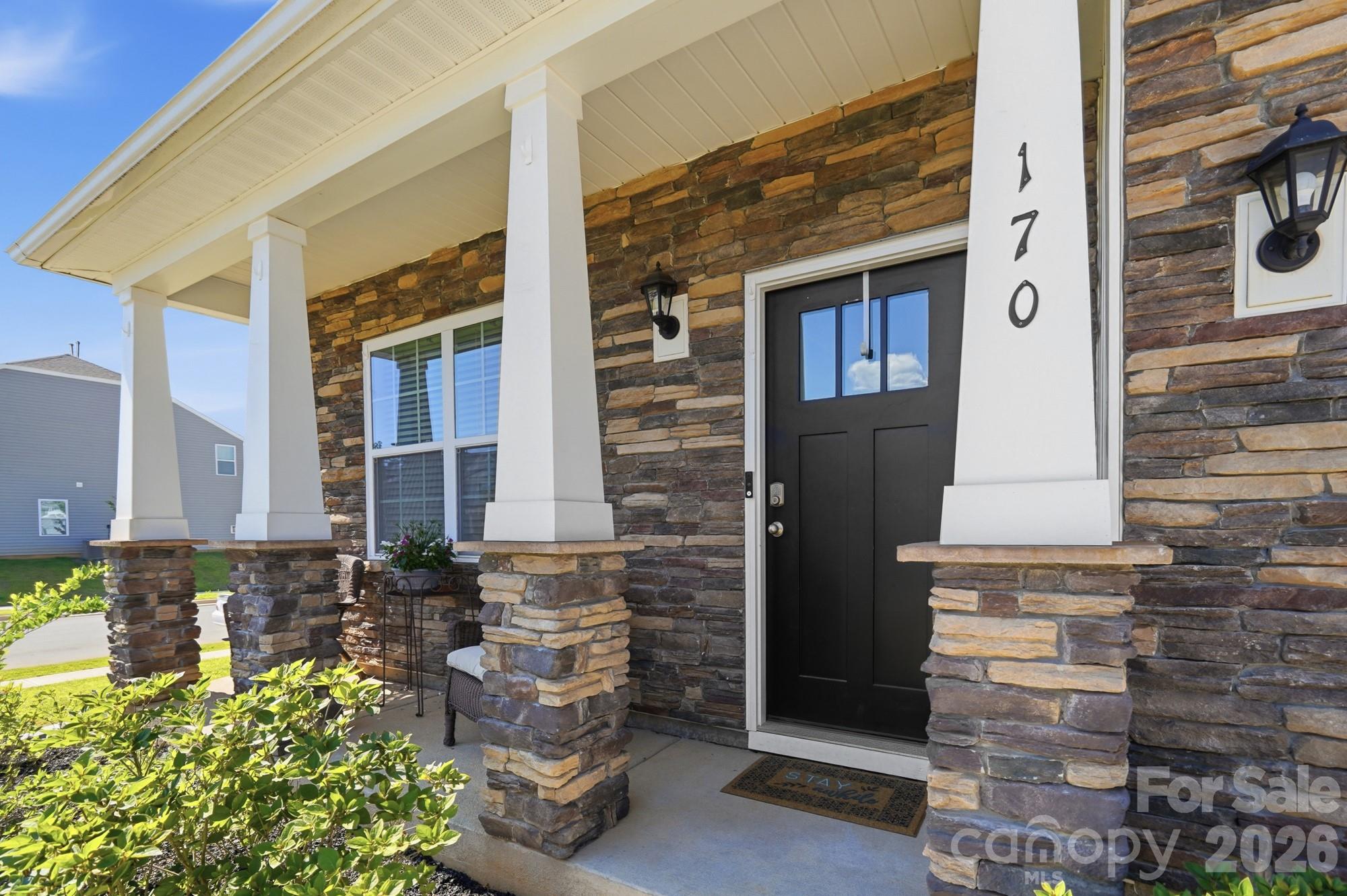 A welcoming front porch—the perfect place to enjoy your morning coffee. - 170 Giant Oak Avenue, Statesville