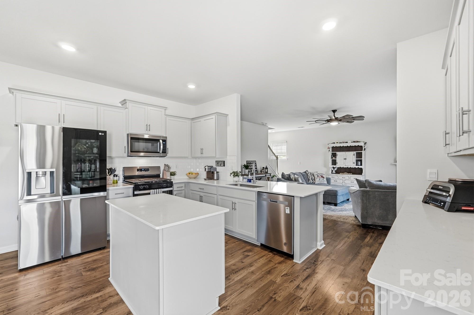 Beautiful cabinetry, stainless appliances, and room for everyone to gather. - 170 Giant Oak Avenue, Statesville