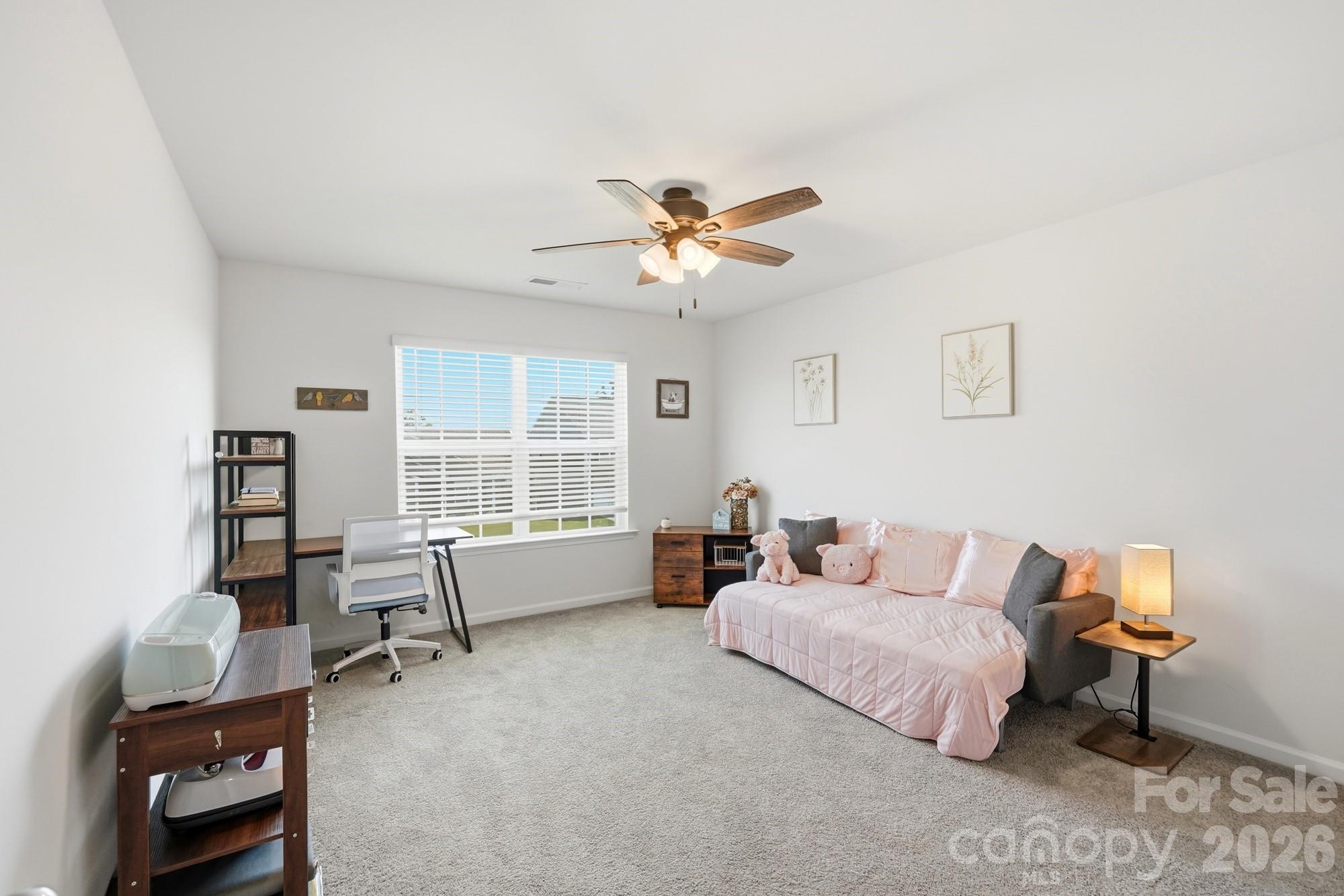 An upstairs loft offers endless possibilities for movie nights, playtime, or a second living area. - 170 Giant Oak Avenue, Statesville