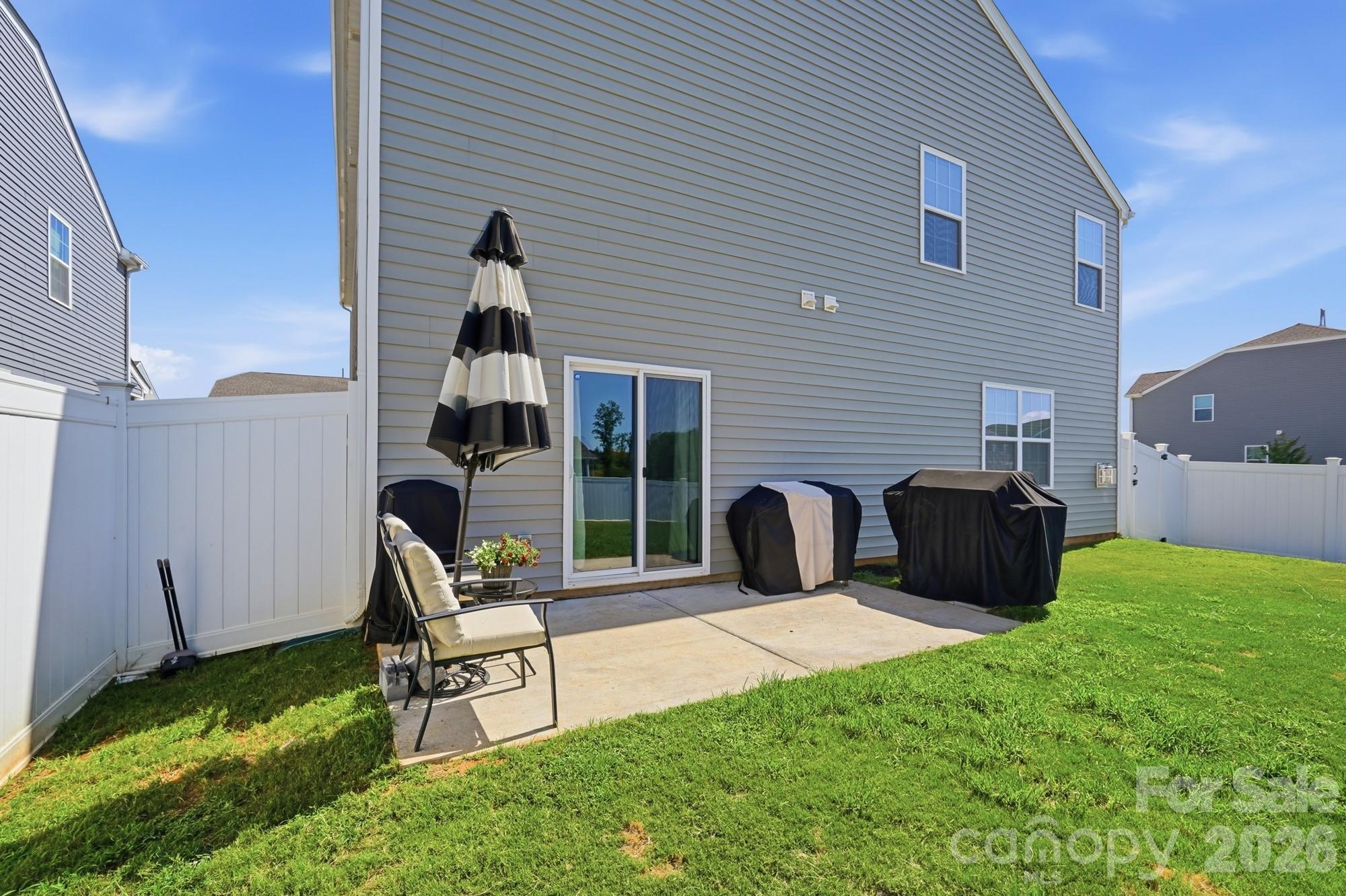 Enjoy grilling, relaxing, or entertaining on your backyard patio. - 170 Giant Oak Avenue, Statesville