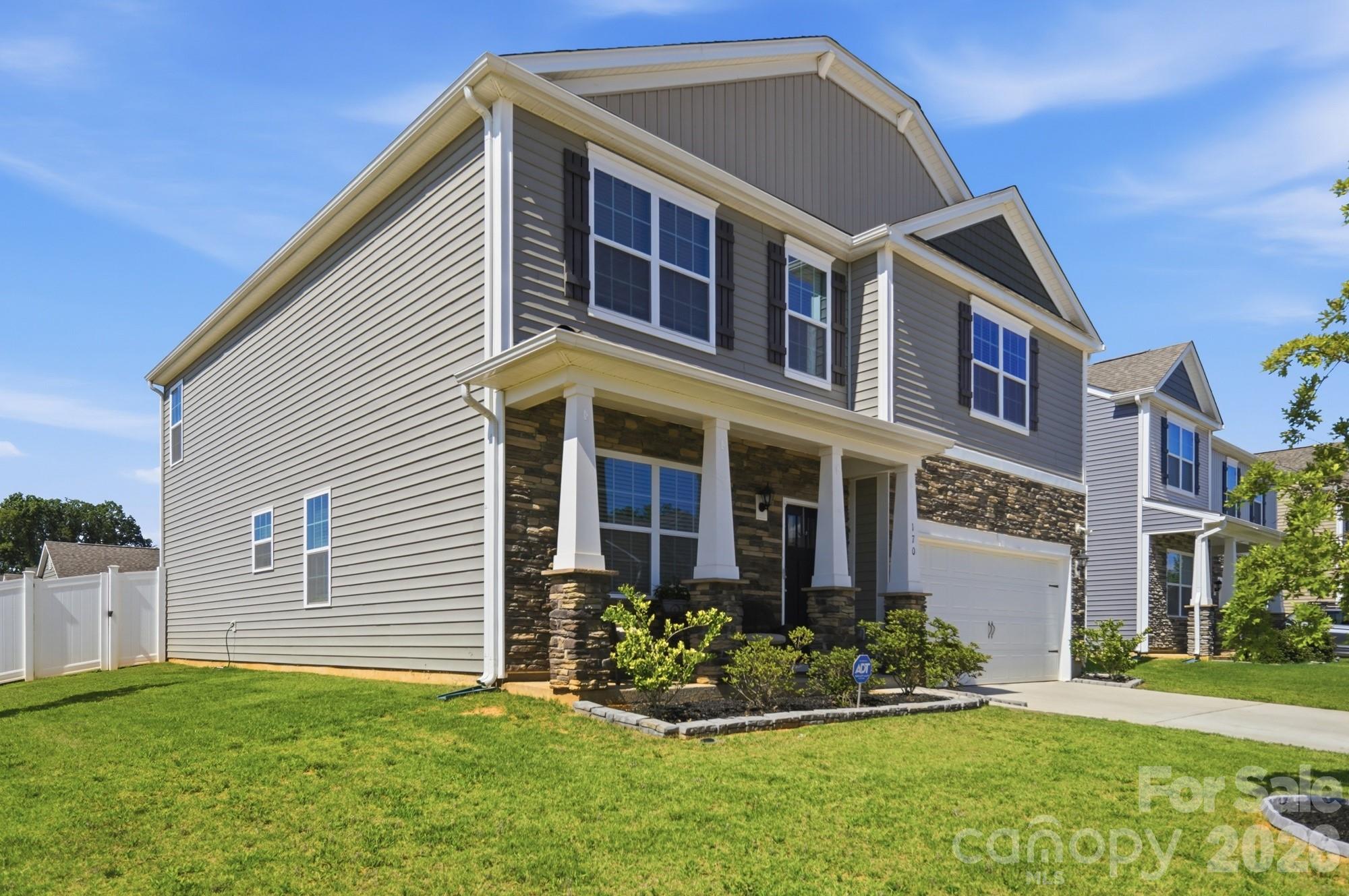 Stone accents and an end-lot setting make this home stand out from the rest. - 170 Giant Oak Avenue, Statesville