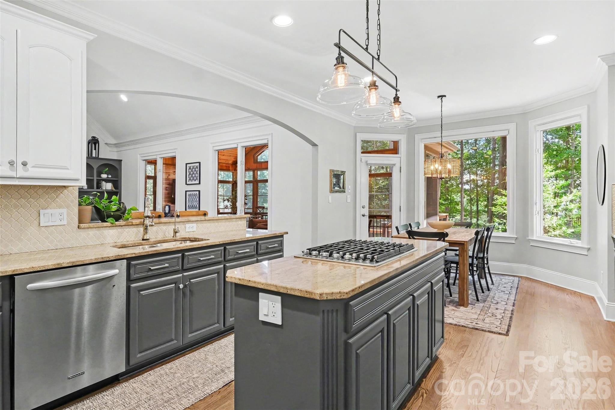 Updated lighting, breakfast bar, and direct access to the impressive 4-season sunroom complete this space. - 109 Whiterock Drive, Mount Holly