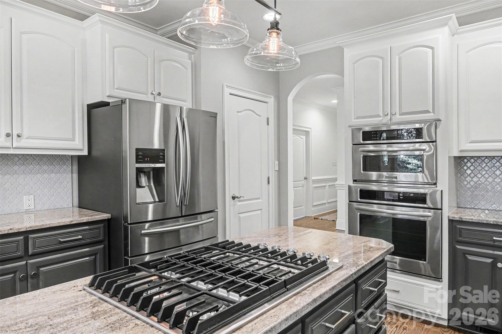Stainless steel appliances including wall ovens, gas cook top, and dishwasher. Refrigerator is negotiable. - 109 Whiterock Drive, Mount Holly