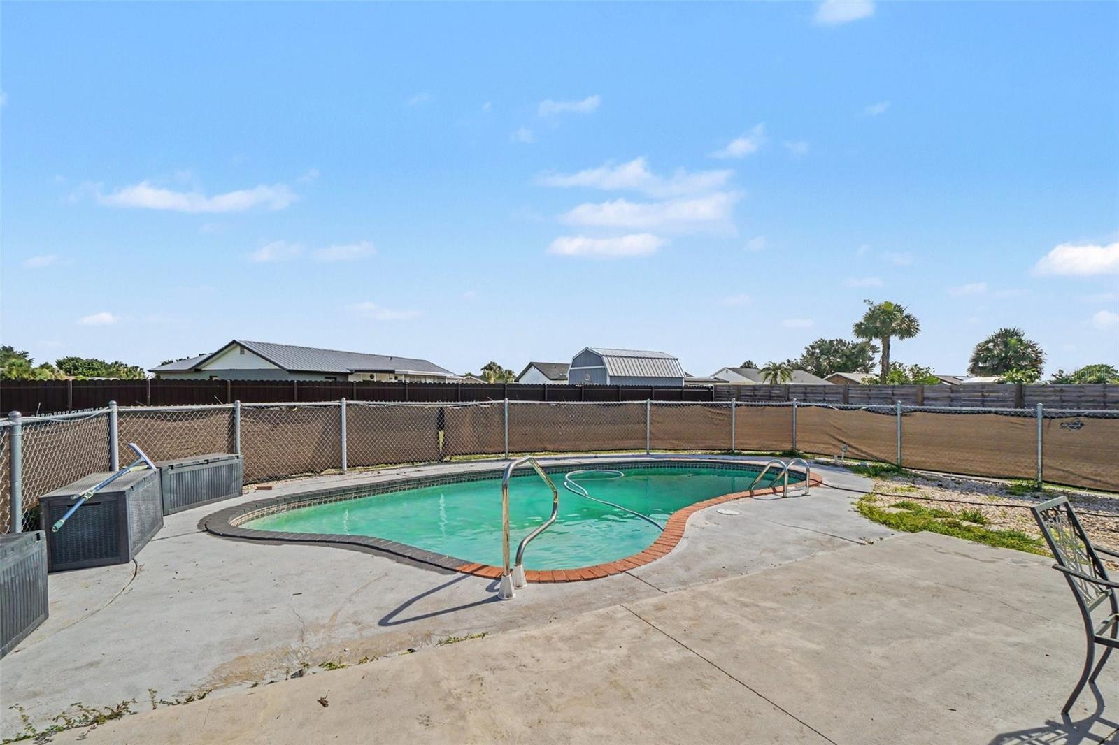 Enclosed pool. The owner will complete the paint trim around the pool deck - 13238 FOWLER AVE, PORT CHARLOTTE