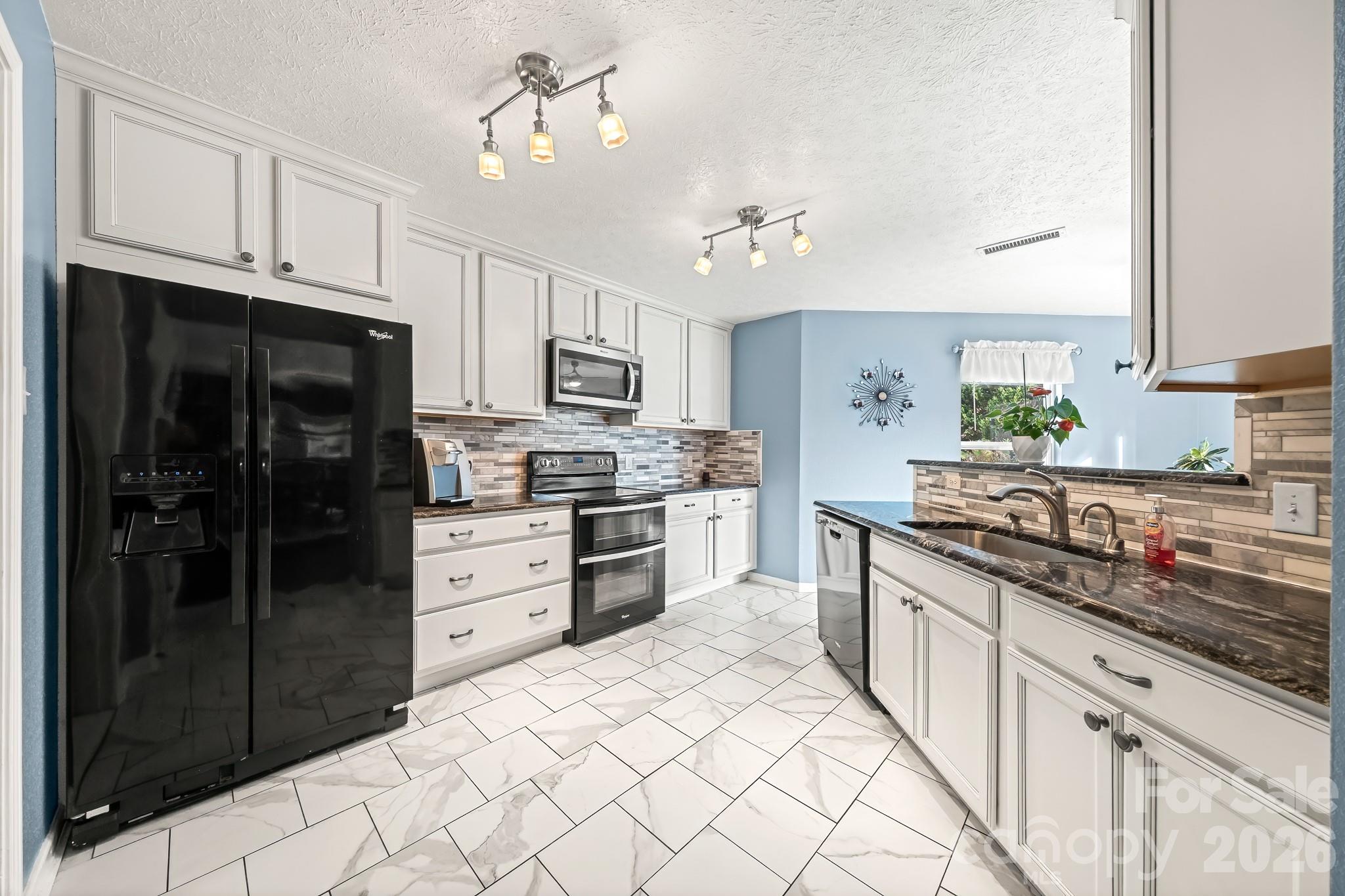 Updated Kitchen Flooring, backsplash and fixtures - 191 Old Carriage Road, Clover