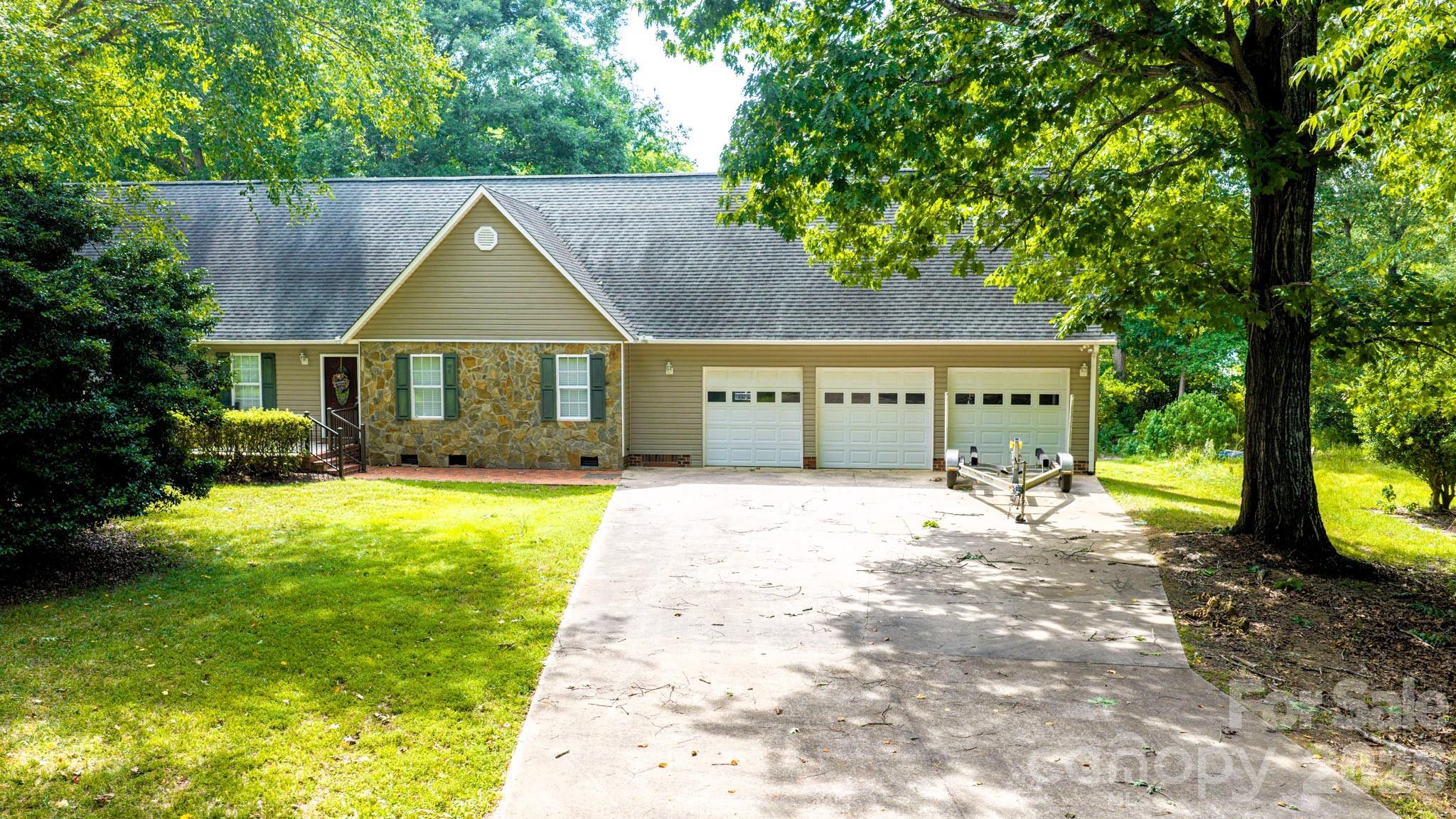 Front of the house, 3 car garage - 130 Canoe Court, Mount Gilead
