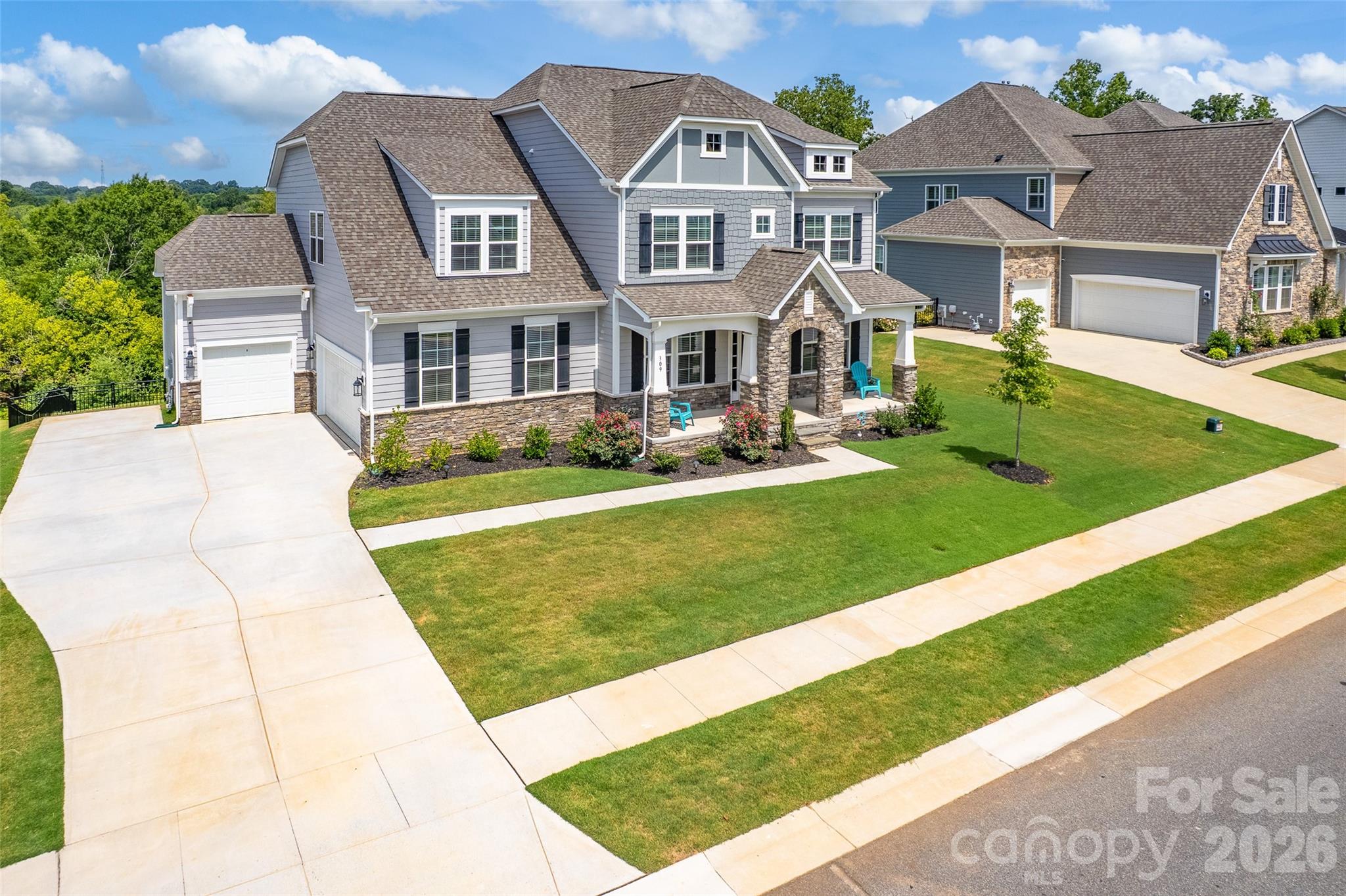 Aerial view of the home with 2 car side garage and golf cart single garage - 309 W Waterlynn Road, Mooresville