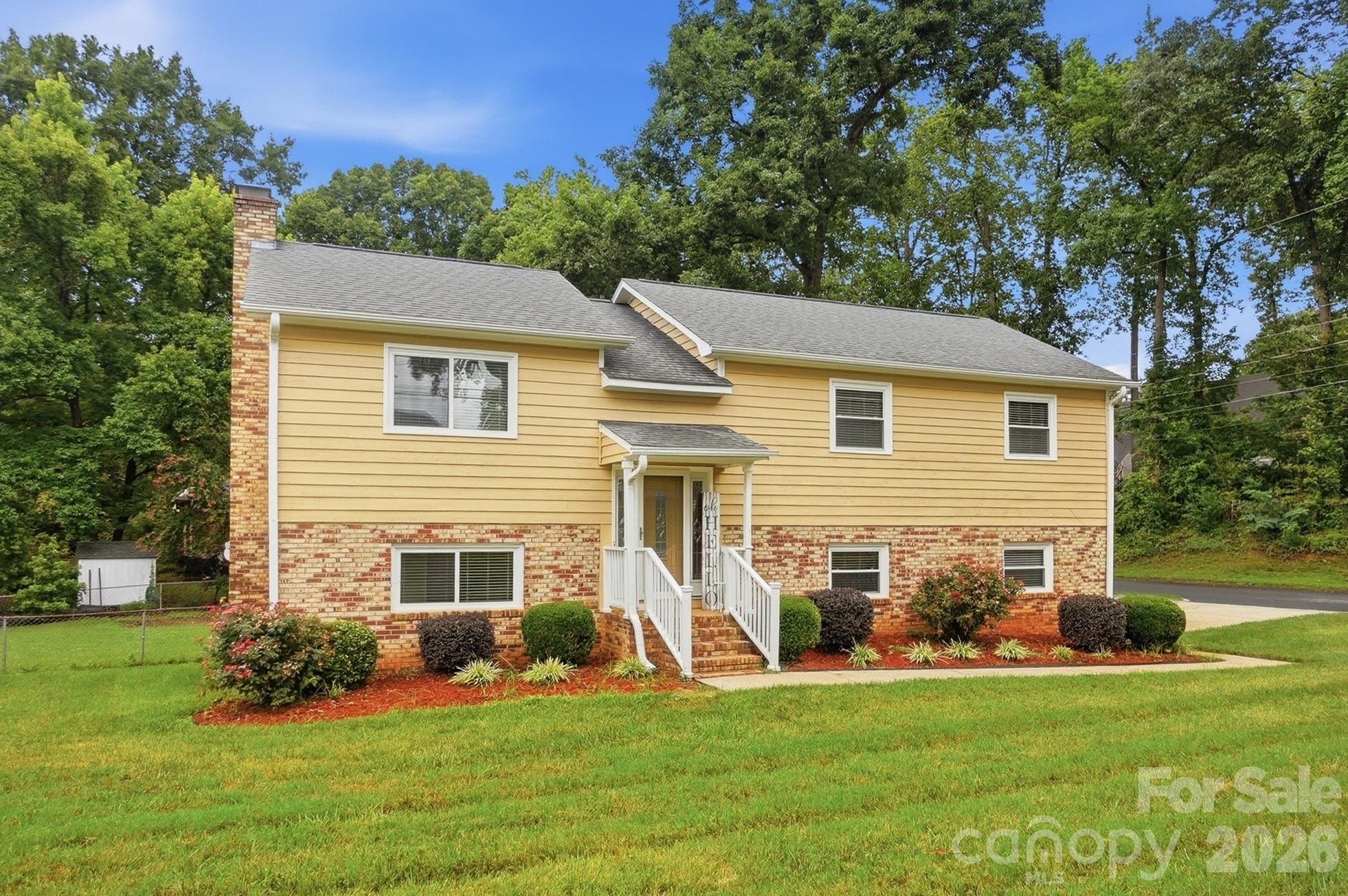 This split-level home is situated on a large, level corner lot - 2600 Providence Drive, Gastonia