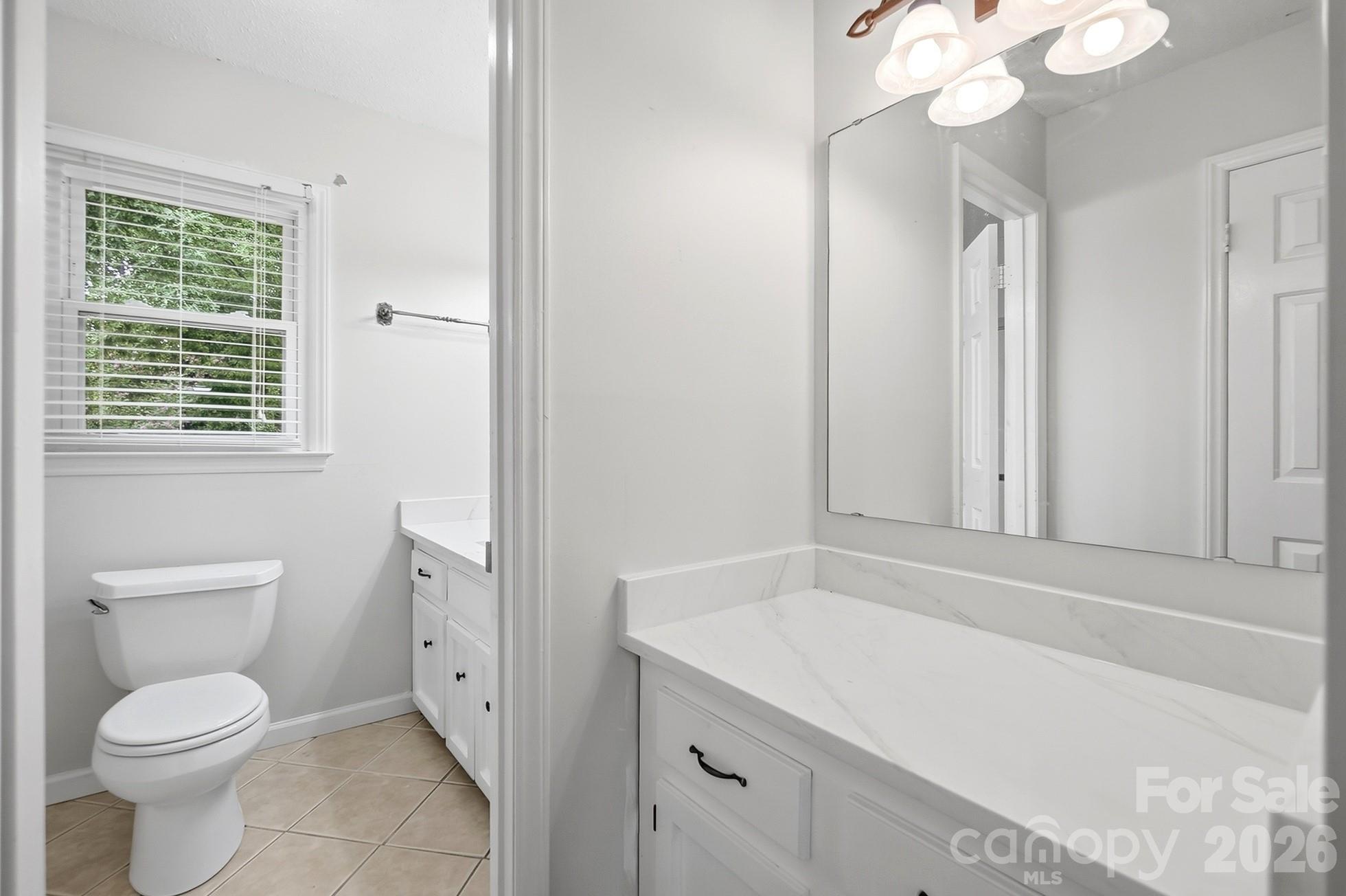 Primary bathroom features upgraded modern countertops - 2600 Providence Drive, Gastonia
