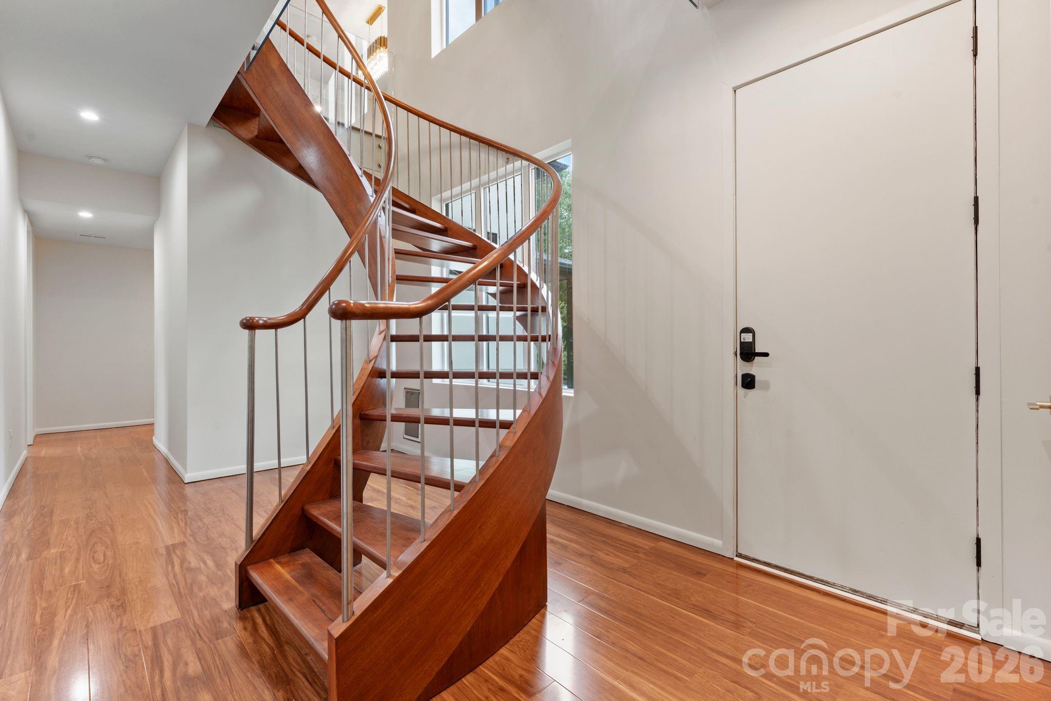 Ground-floor walk-out level with direct pool access and guest bedrooms - 1064 Greylyn Drive, Matthews