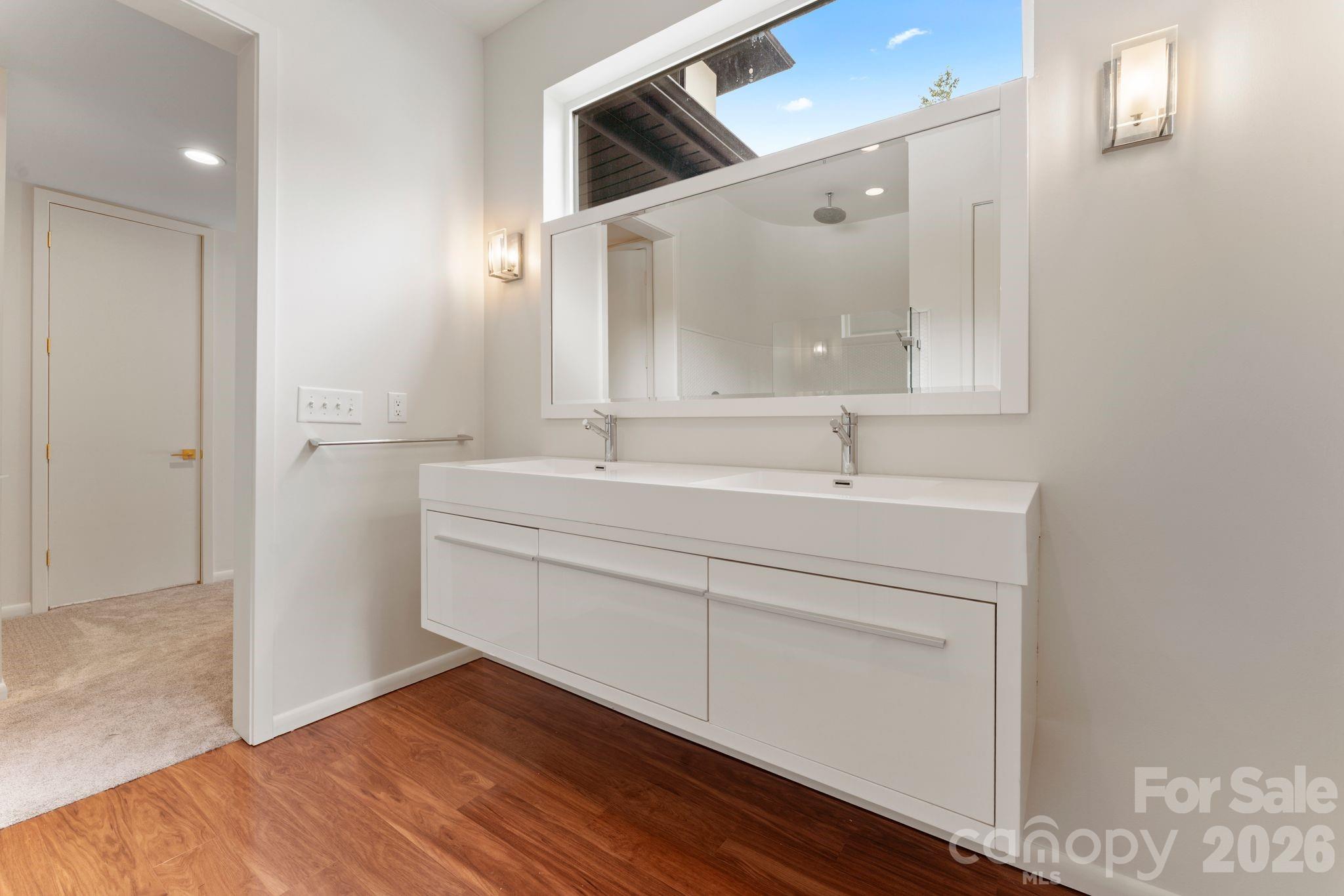 Full ground-floor guest suite with private entrance, pool access, and en-suite bathroom - 1064 Greylyn Drive, Matthews