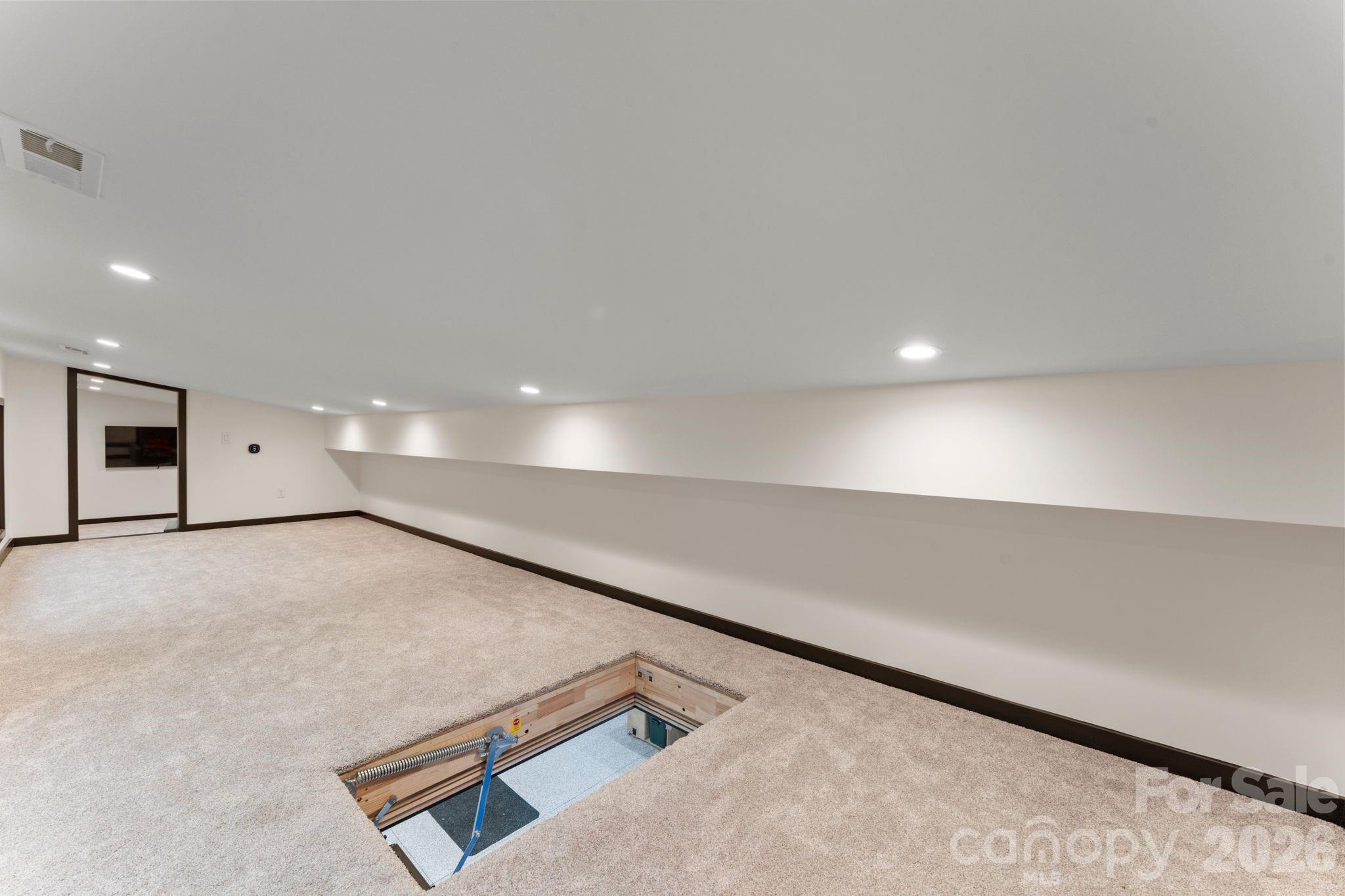 Fully conditioned clubhouse / flex bonus room above the garage with dedicated heating and cooling and TV lounge area - 1064 Greylyn Drive, Matthews