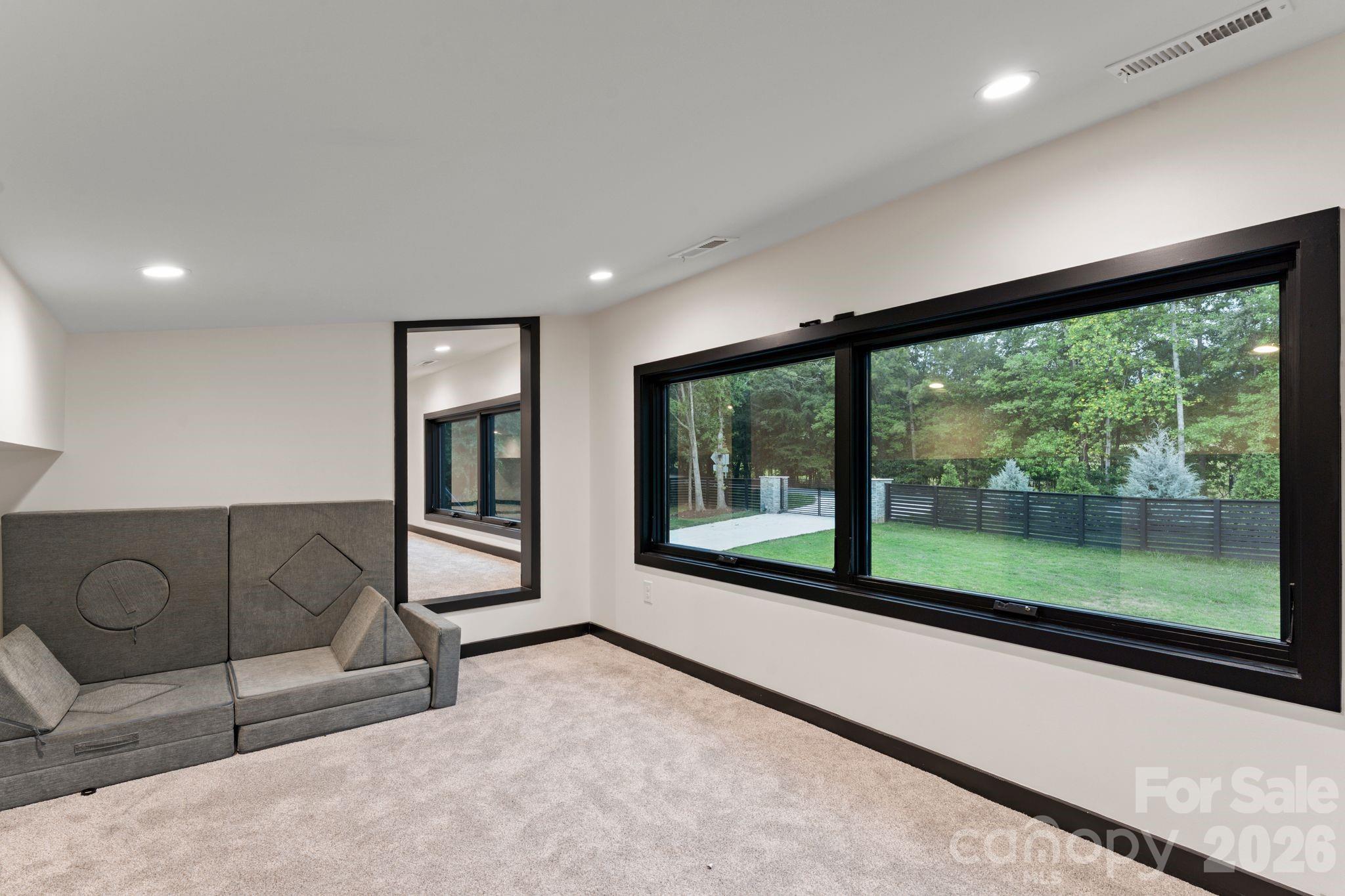 Fully conditioned clubhouse / flex bonus room above the garage with dedicated heating and cooling and TV lounge area - 1064 Greylyn Drive, Matthews