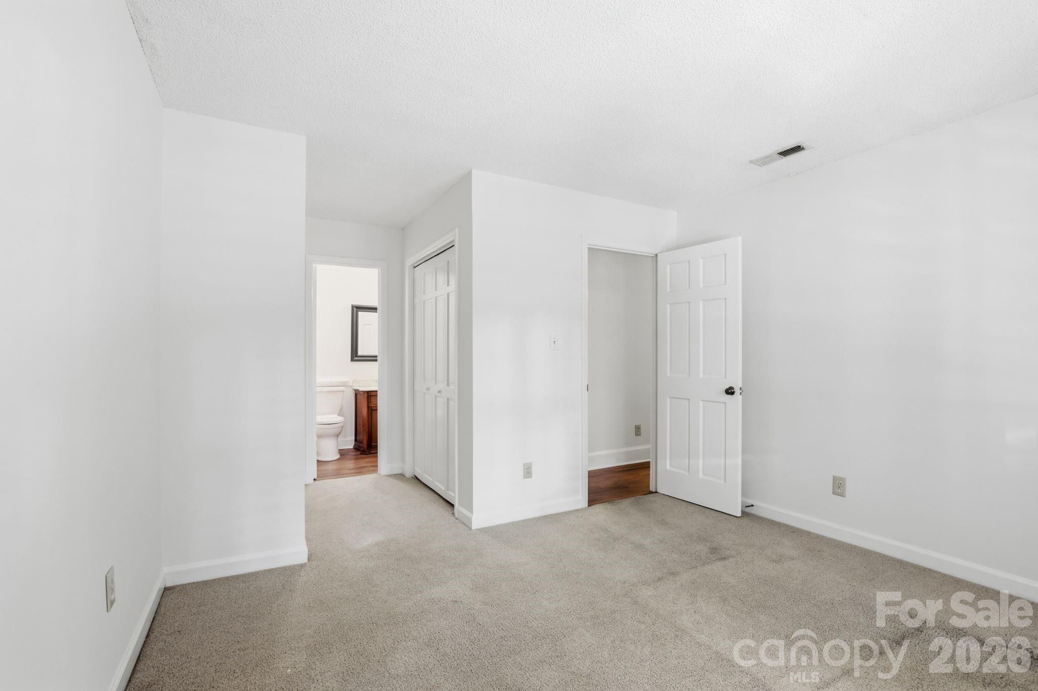First floor primary bedroom with ensuite bath - 2500 Round Table Road, Monroe