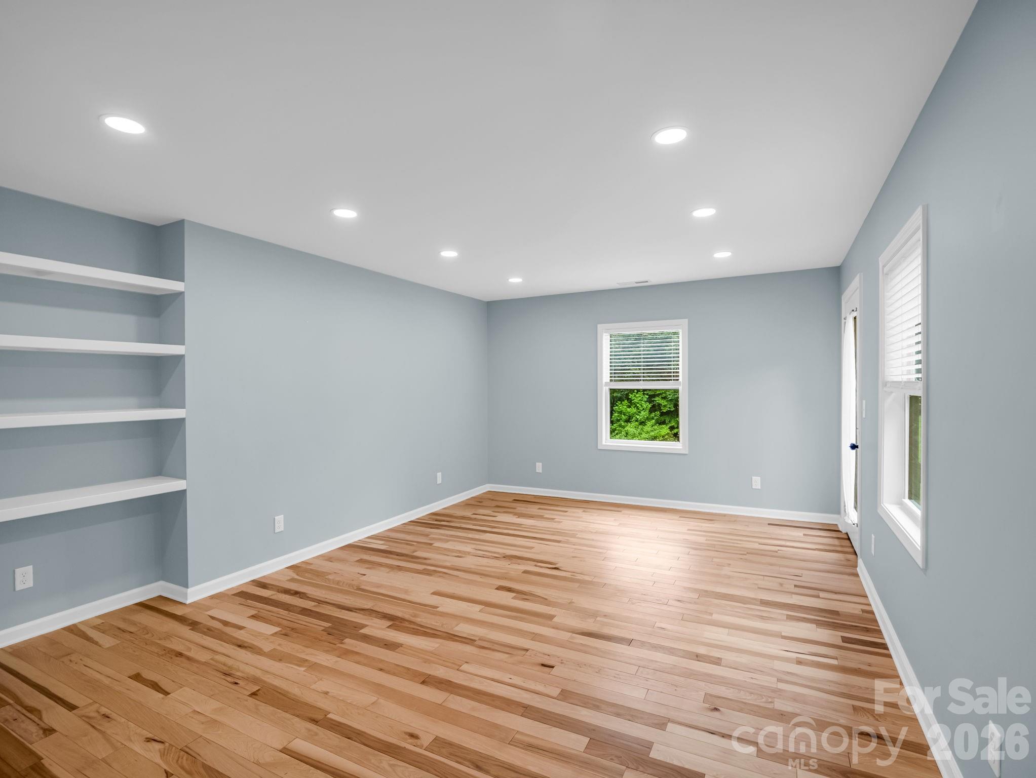 Dedicated office/private den off of the primary bedroom with door to back yard - 35 Chastain Hill Road, Mills River