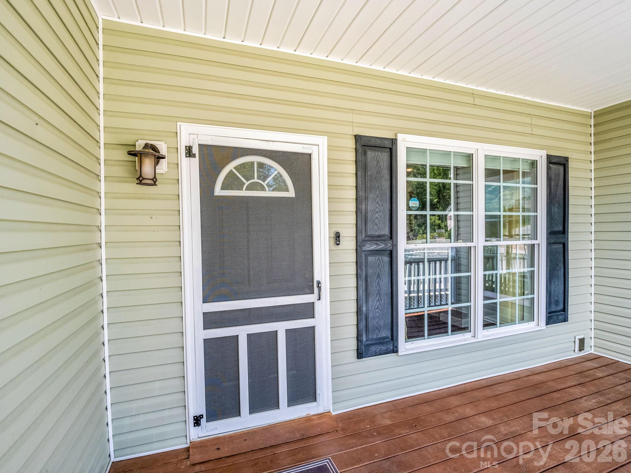 Covered front porch with space for outdoor furniture. - 355 Hidden Meadow Drive, Hendersonville