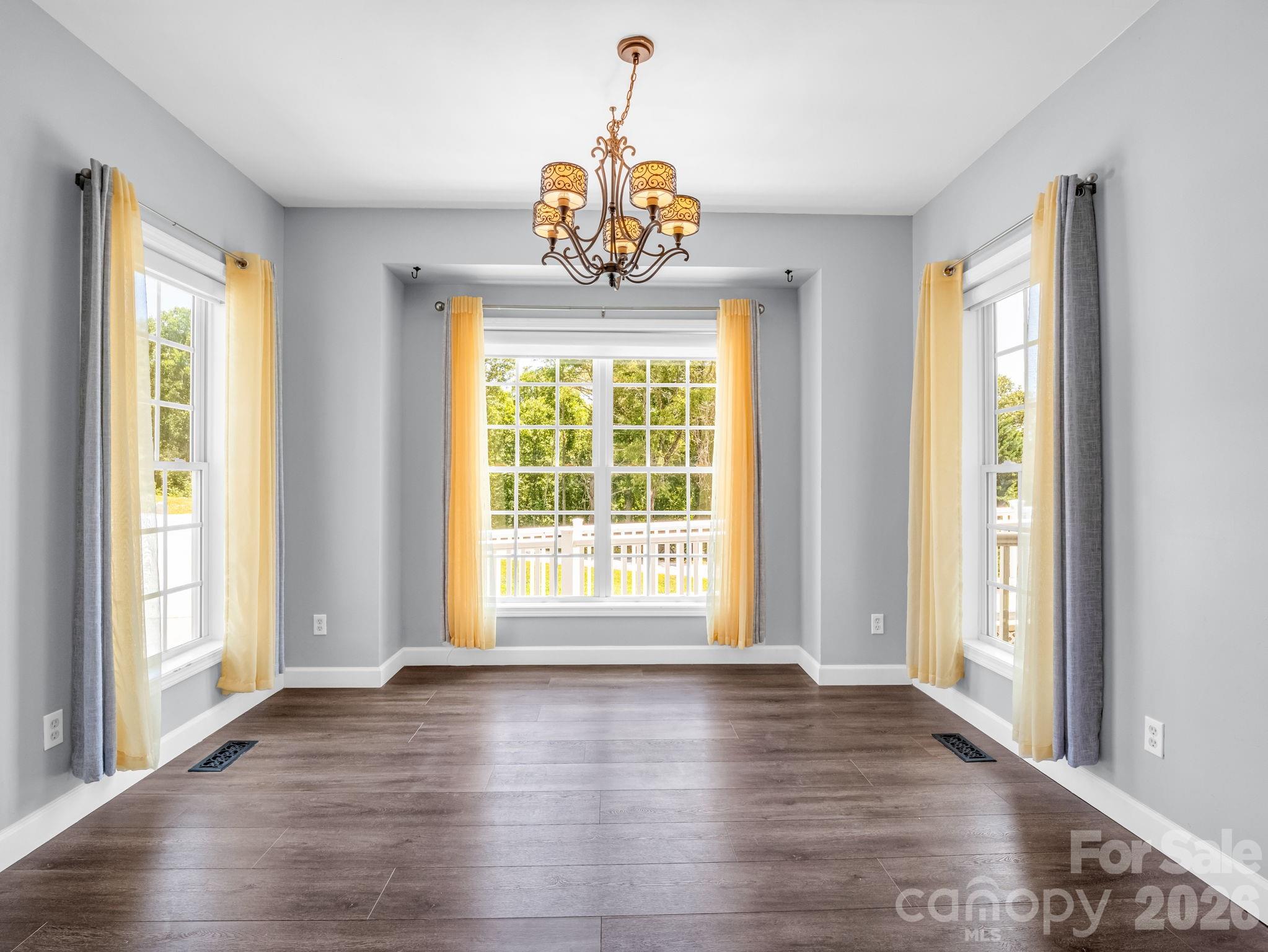 View of dining area from kitchen. The sunrises from this room are breathtaking. - 355 Hidden Meadow Drive, Hendersonville