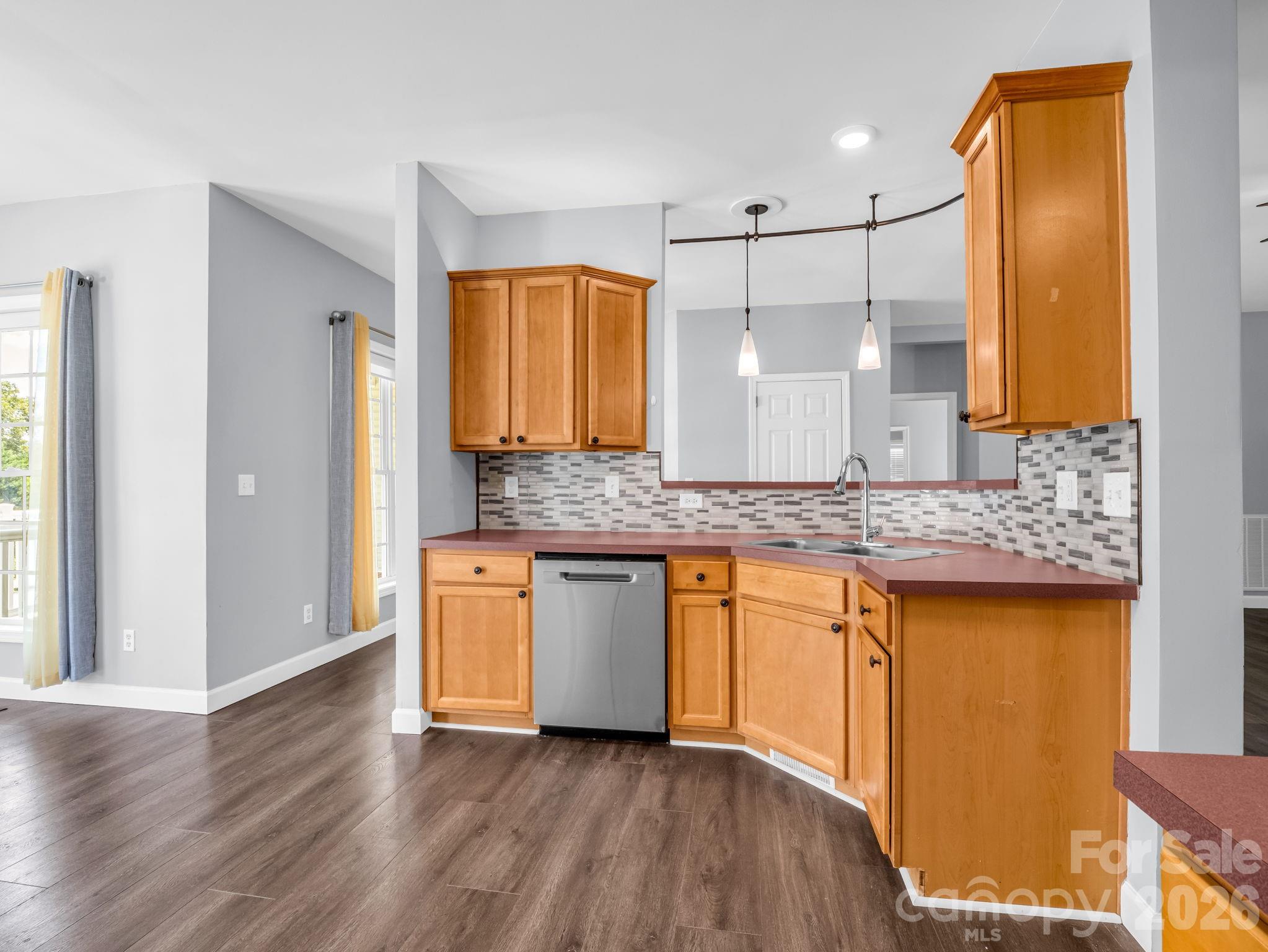 View of left side of the kitchen; dishwasher is approximately 2 years old. - 355 Hidden Meadow Drive, Hendersonville