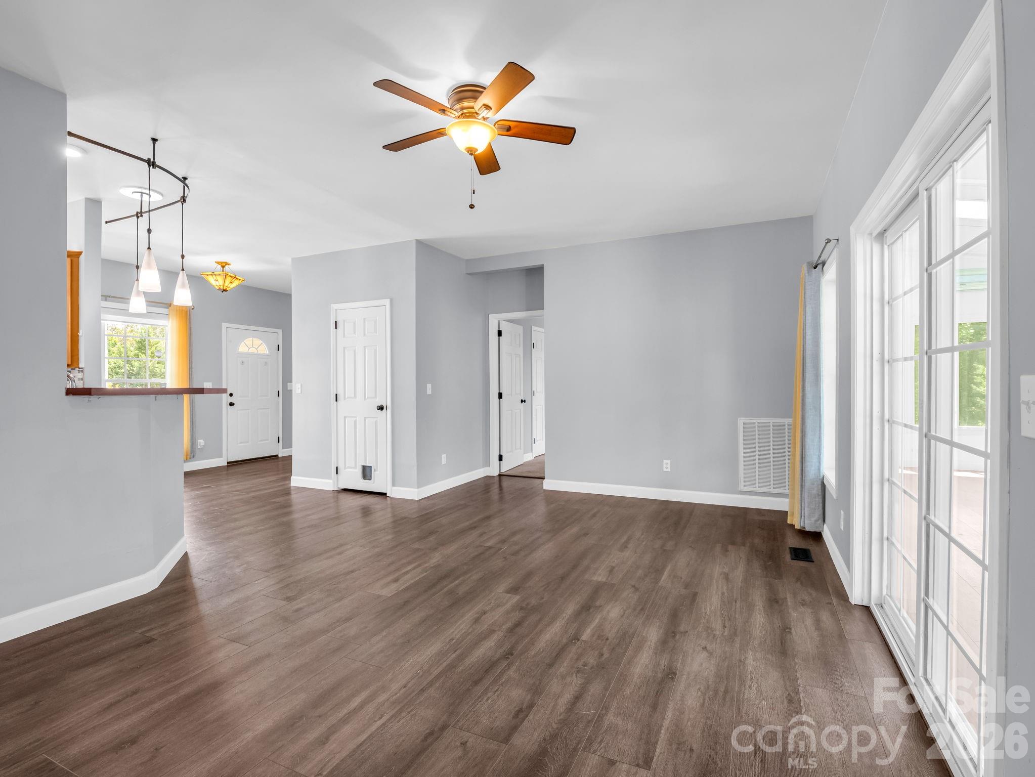 View from living area looking towards entrance into the primary bedroom with en-suite. - 355 Hidden Meadow Drive, Hendersonville