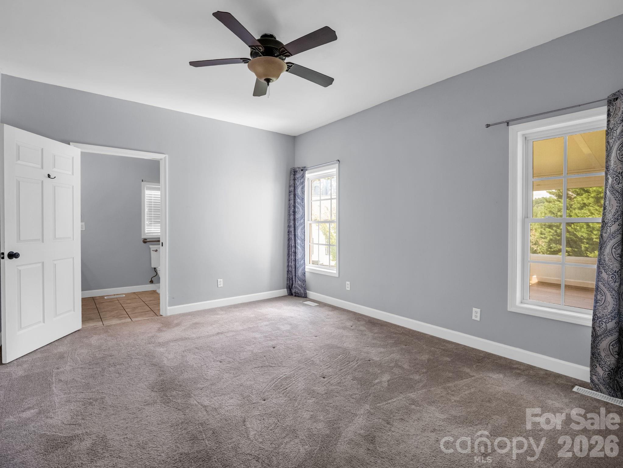 Primary bedroom looking into en-suite. - 355 Hidden Meadow Drive, Hendersonville