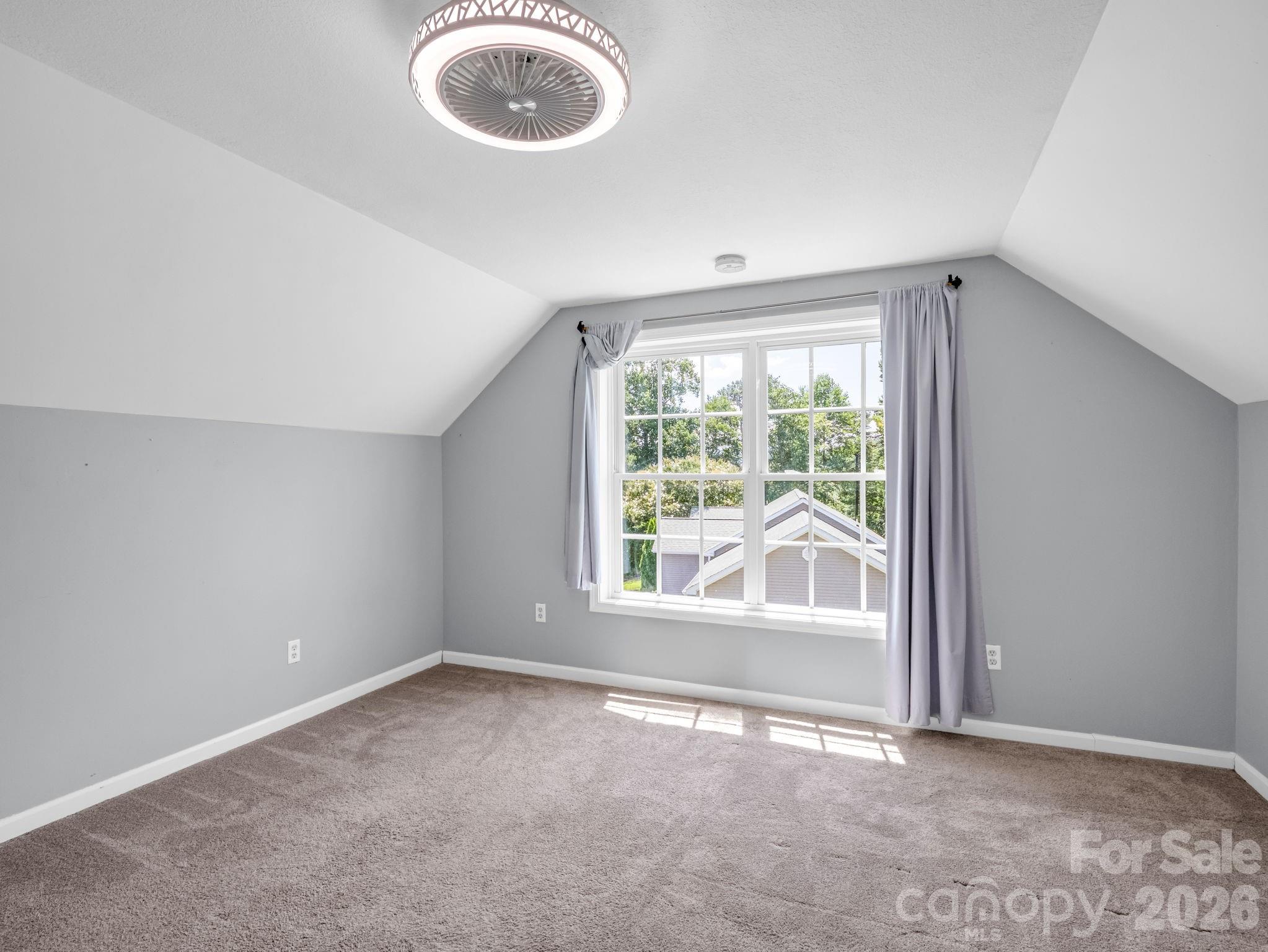 Bedroom # 3 - don't miss the beautiful mountain views from this room. Low-profile ceiling fan new within the last few years. - 355 Hidden Meadow Drive, Hendersonville