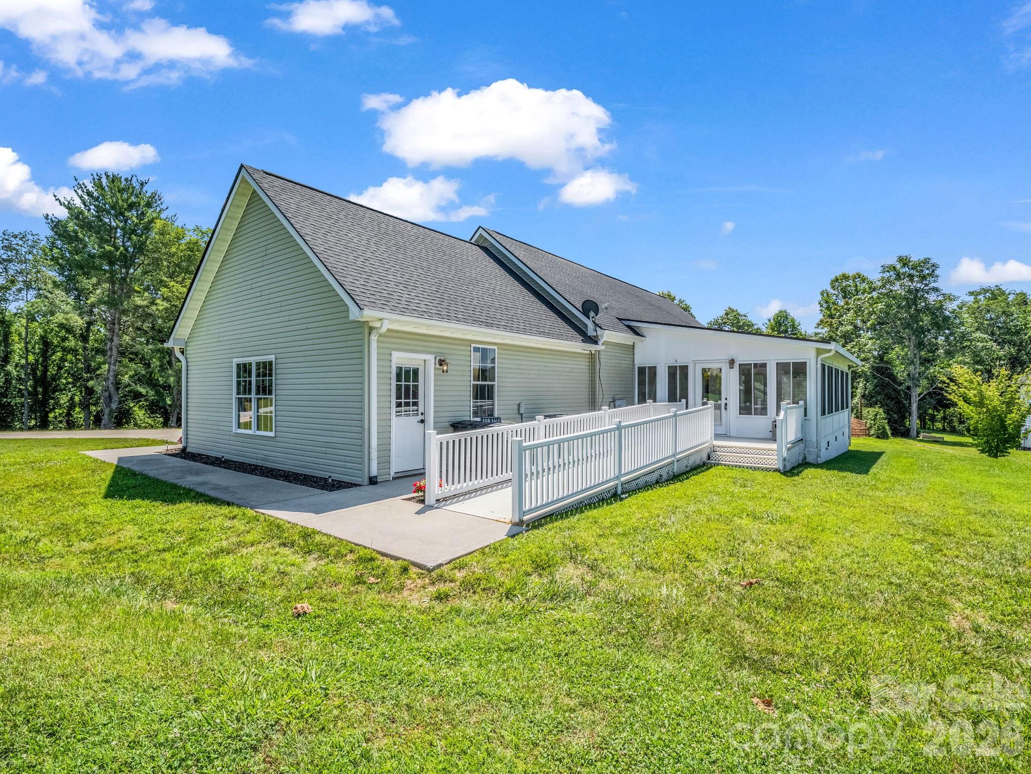 Side view of back of home. - 355 Hidden Meadow Drive, Hendersonville