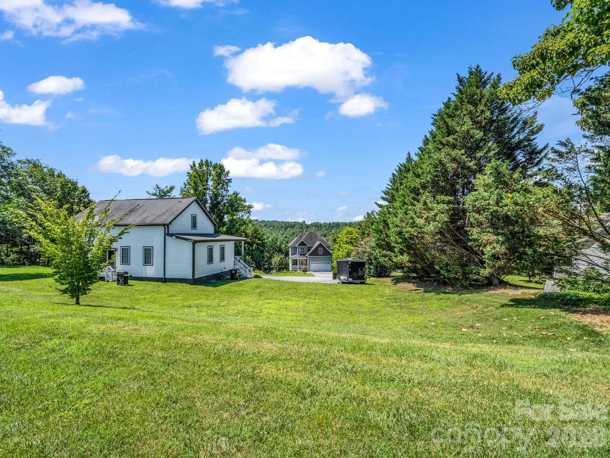 Enjoy serene views from the West facing backyard, as well as breathtaking sunsets. - 355 Hidden Meadow Drive, Hendersonville