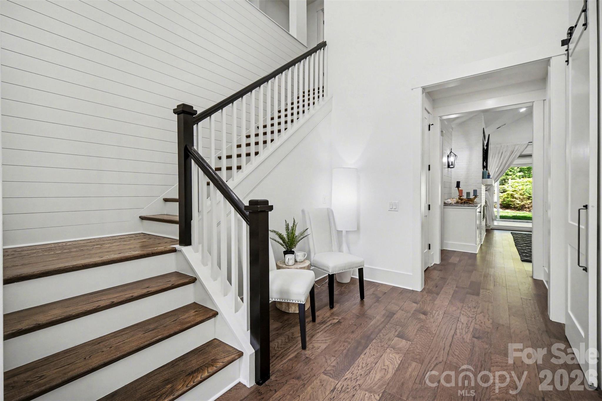Two story foyer with prefinished hardwoods, shiplap molding, overlook from the cozy reading nook upstairs - 3142 Sherman Drive, Lancaster