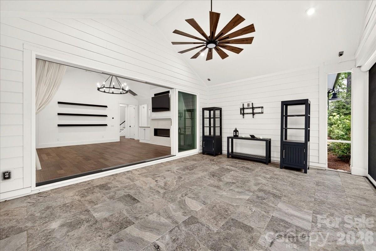 The sliding door and motorized screen extends the family room for extra entertaining/dining space - 3142 Sherman Drive, Lancaster