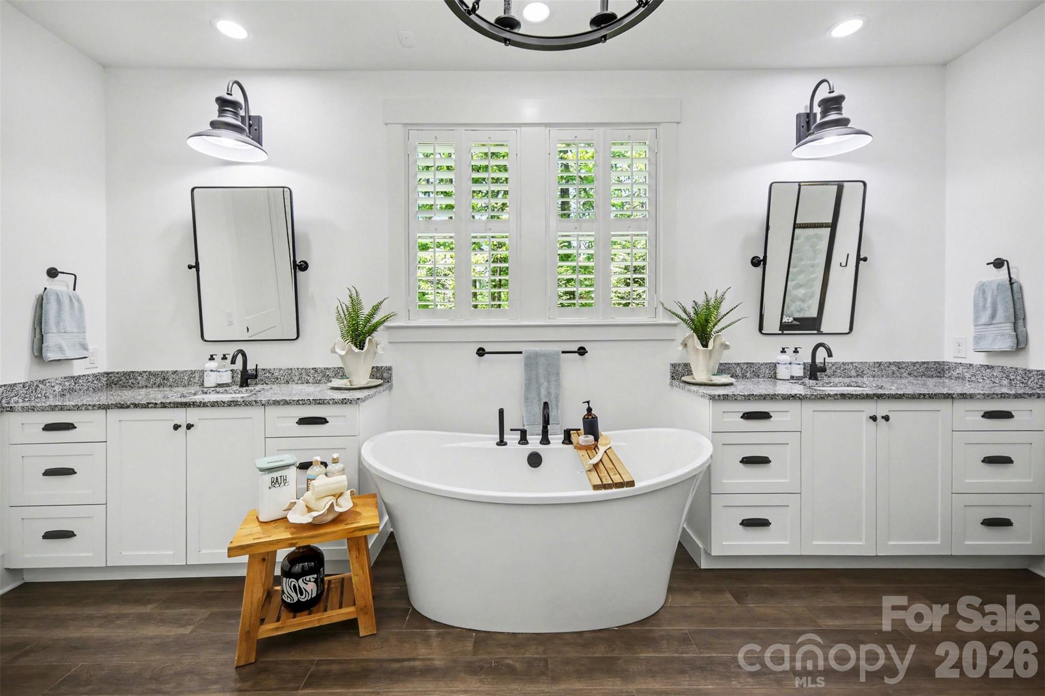 Welcome to your "spa" bathroom! This space has a gorgeous freestanding soaking tub, tile flooring, separate raised vanities, Pottery barn mirrors remain - 3142 Sherman Drive, Lancaster