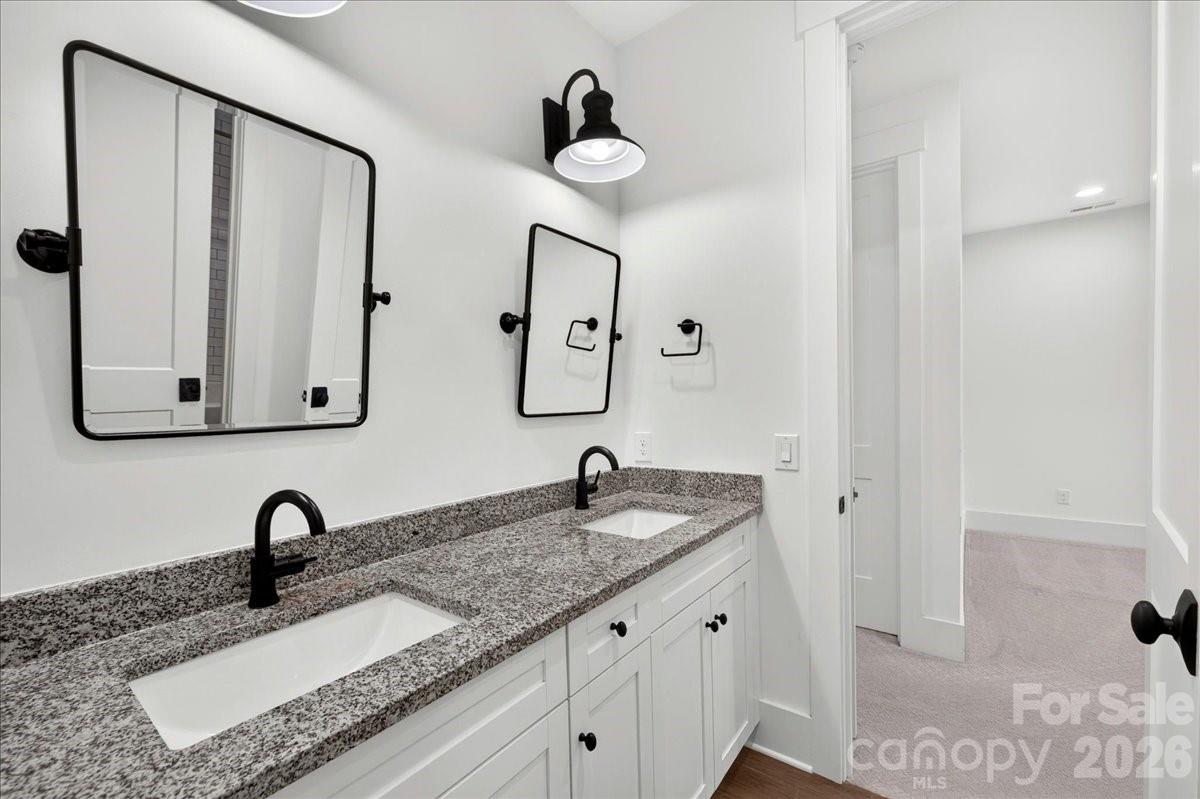 Bedroom 4 bathroom with dual sinks, large vanity,tile flooring and private water closet/shower area- This bathroom is shared with Bedroom 3 - 3142 Sherman Drive, Lancaster