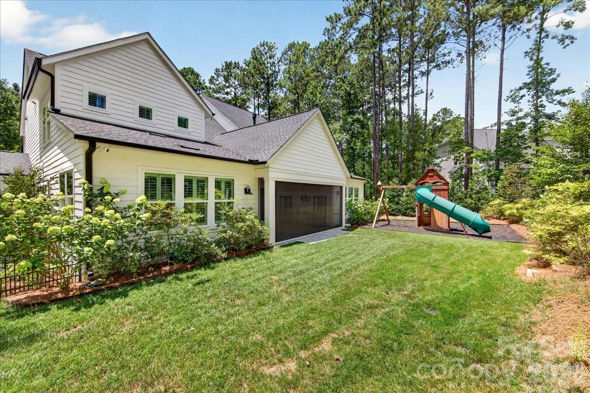 Screen porch area with motorized screening- landscaped for privacy and play set will remain - 3142 Sherman Drive, Lancaster