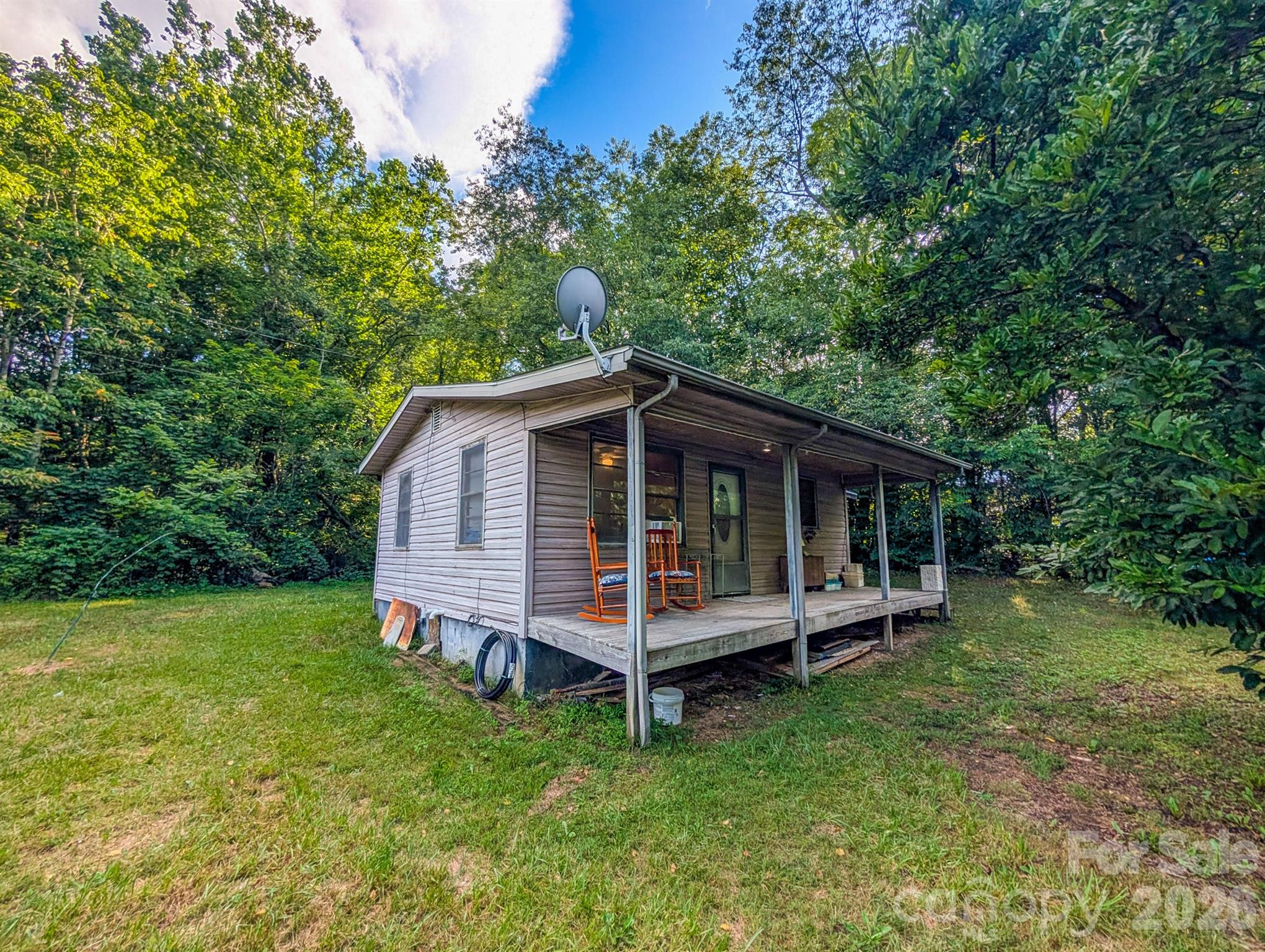 Front of property with covered front porch and crawl space access can be seen to left. - 172 Lower Browns Creek Road, Burnsville