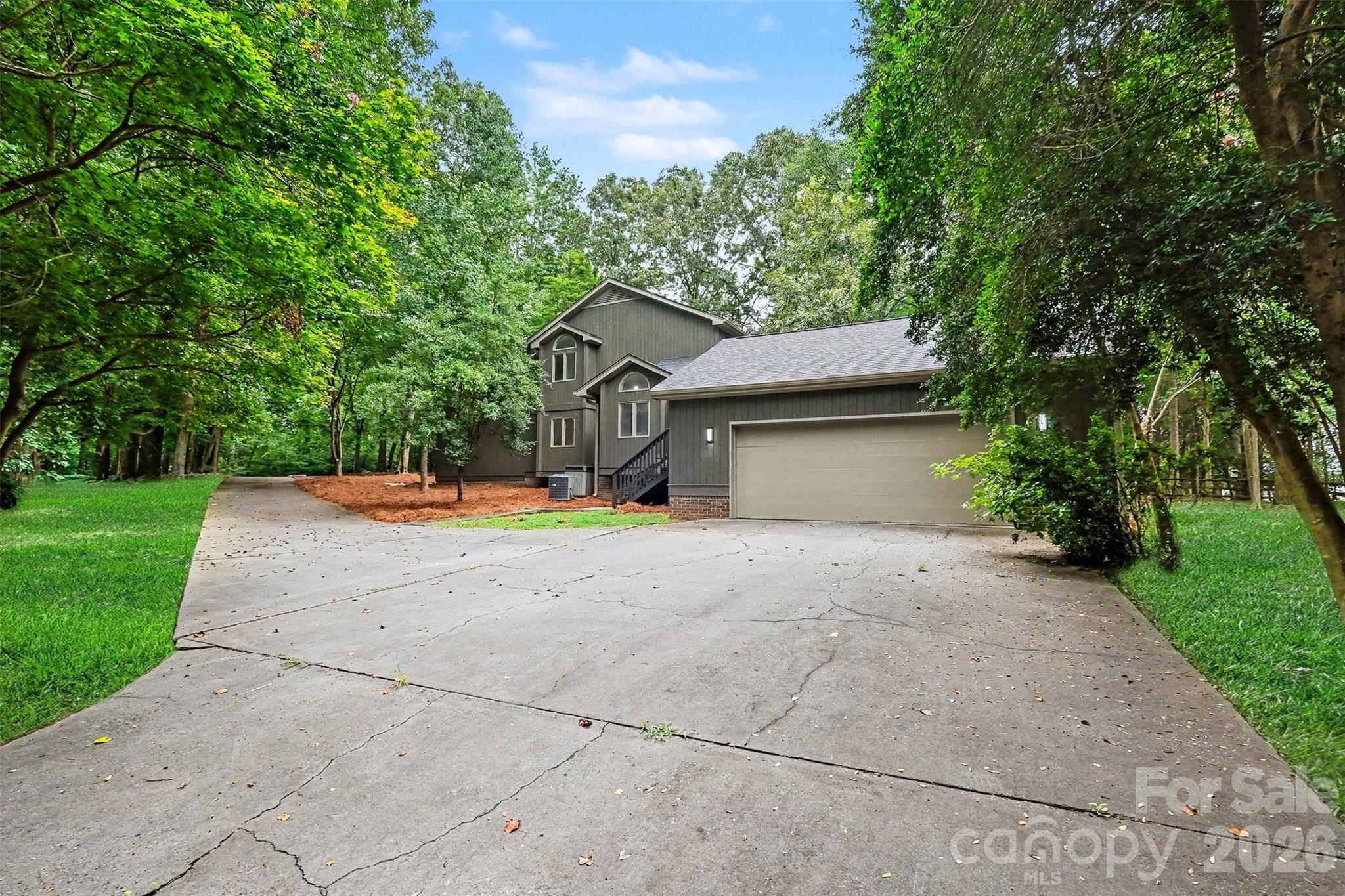 Plenty of space by the garage for a basketball hoop, too. Or plenty of parking when you host Panthers Watch Parties and holiday BBQs. - 5042 Marci Lane, Belmont