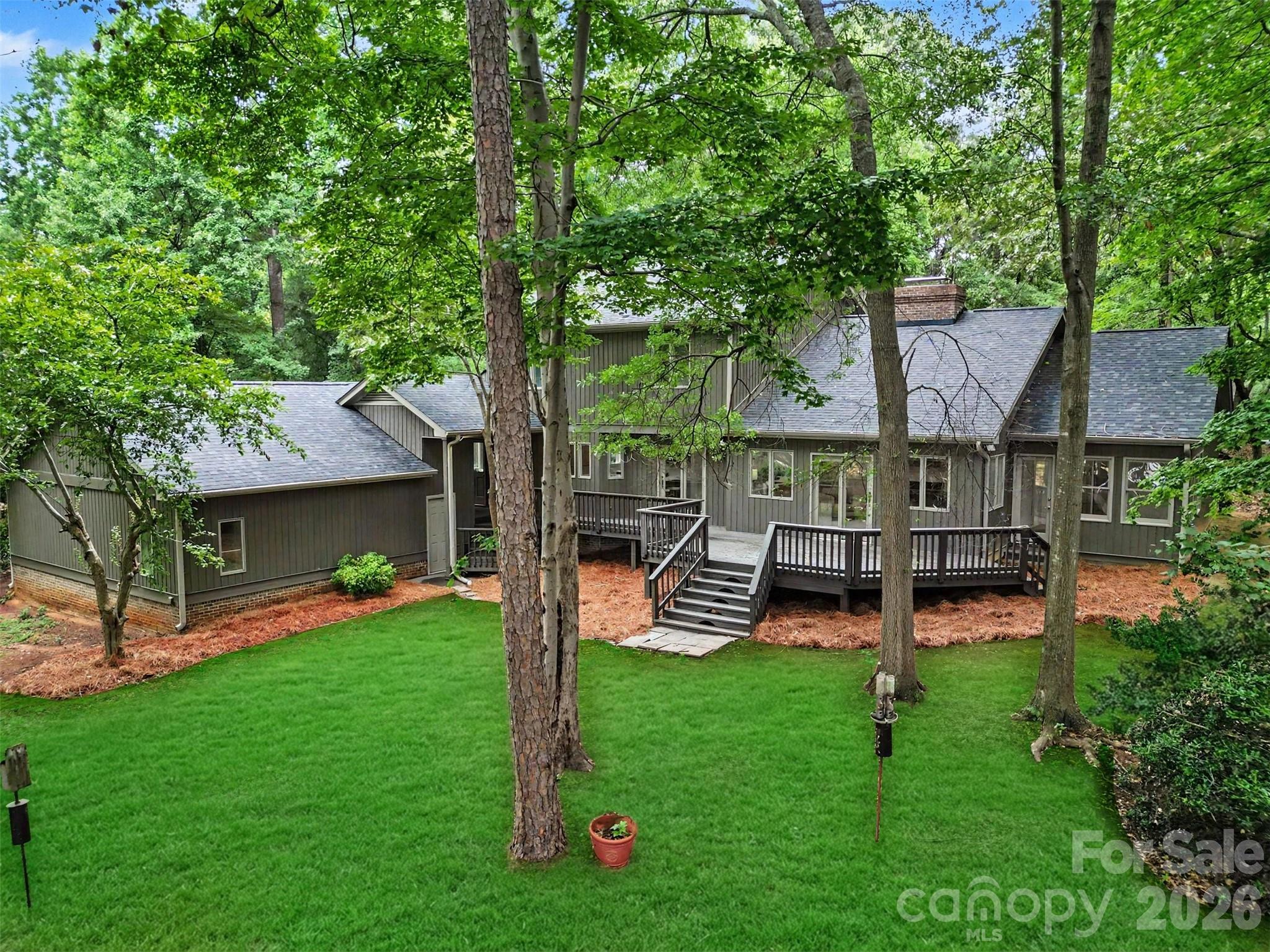 Your 0.82-acre lot is full of gorgeous mature trees. - 5042 Marci Lane, Belmont
