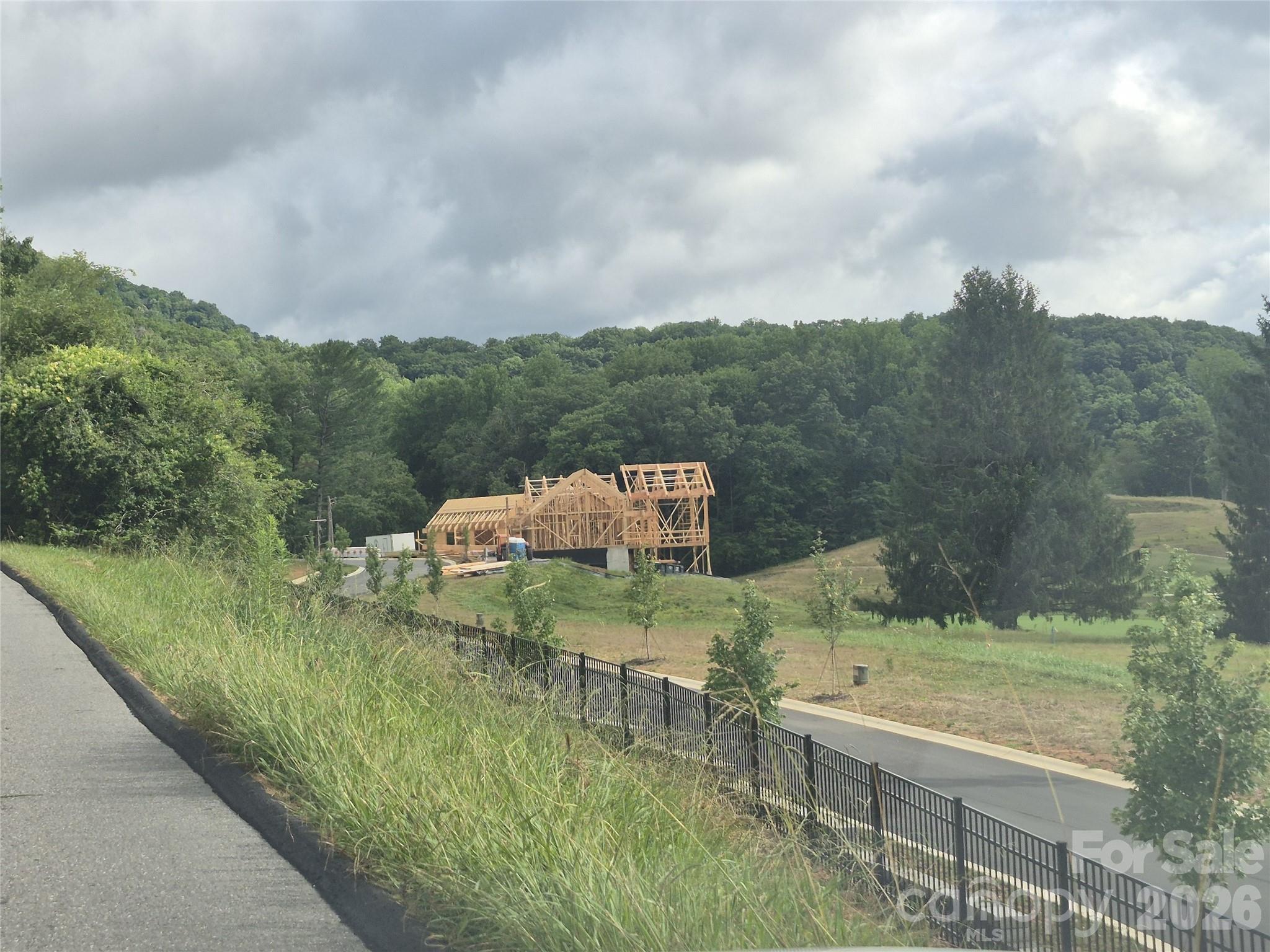 Street View looking toward new const on adjacent lot - 30 Farmer Branch Lane, Waynesville